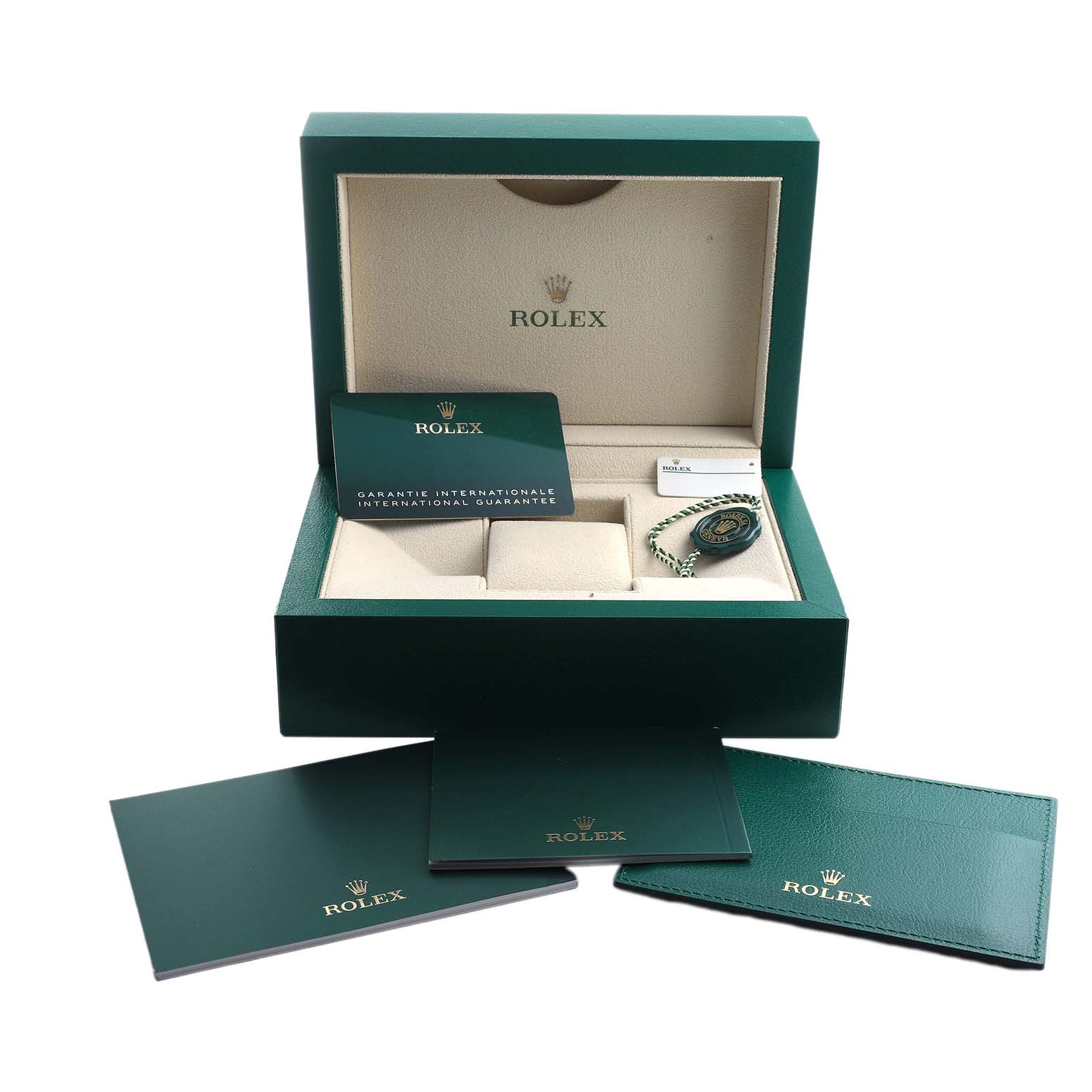 The box for the Rolex Yacht-Master 126622 Men's Stainless Steel Silver Dial is shown open from above, displaying its warranty card and accessories.