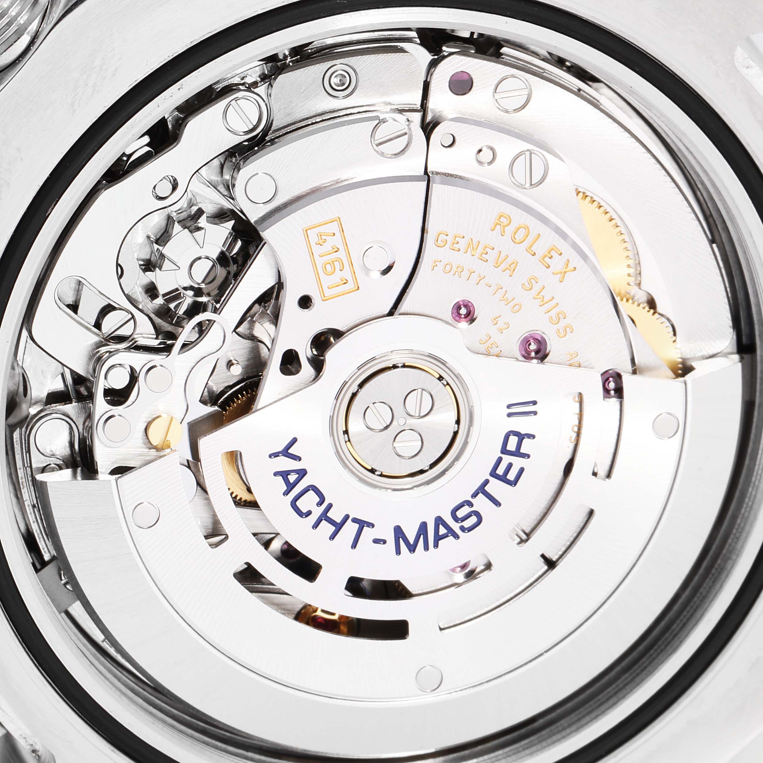 The image shows the intricate inner mechanisms of a Rolex Yacht-Master 116680 Men
s Stainless Steel White Dial 116680 Men
s Stainless Steel White Dial II watch from a close-up angle.