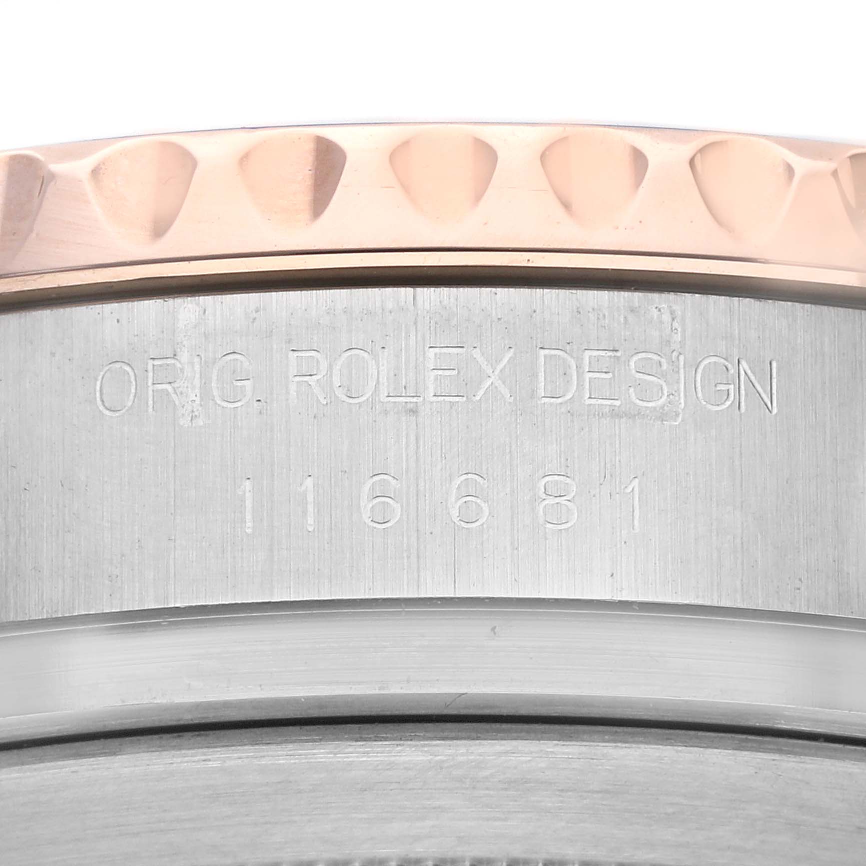 This close-up image shows the side detail of a Rolex Yacht-Master 116681 Men's Steel and Gold (two tone) White Dial 116681 Men's Steel and Gold (two tone) White Dial watch, featuring the model number and "ORIG. ROLEX DESIGN" engraving.