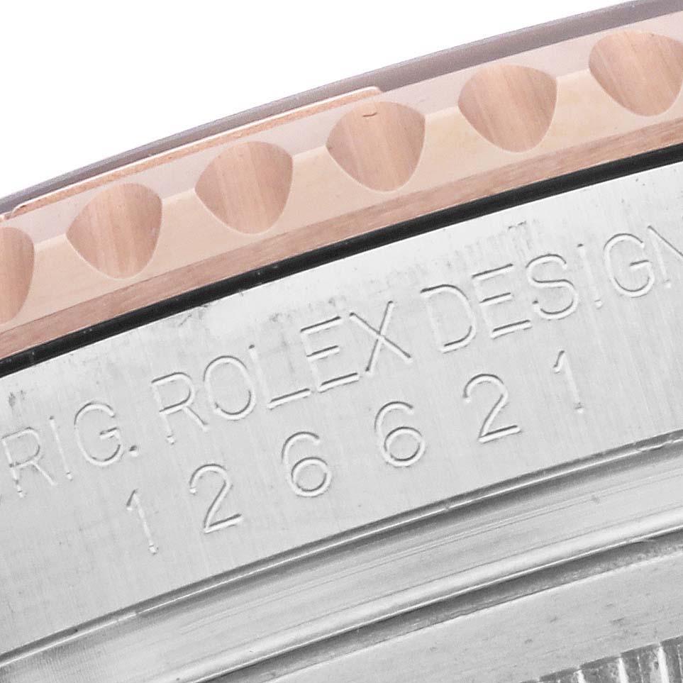 This close-up shot of the Rolex Yacht-Master 126621 Men's Steel and Gold (two tone) Black Dial 126621 Men's Steel and Gold (two tone) Black Dial model shows part of the bezel and the engraving on the case side.