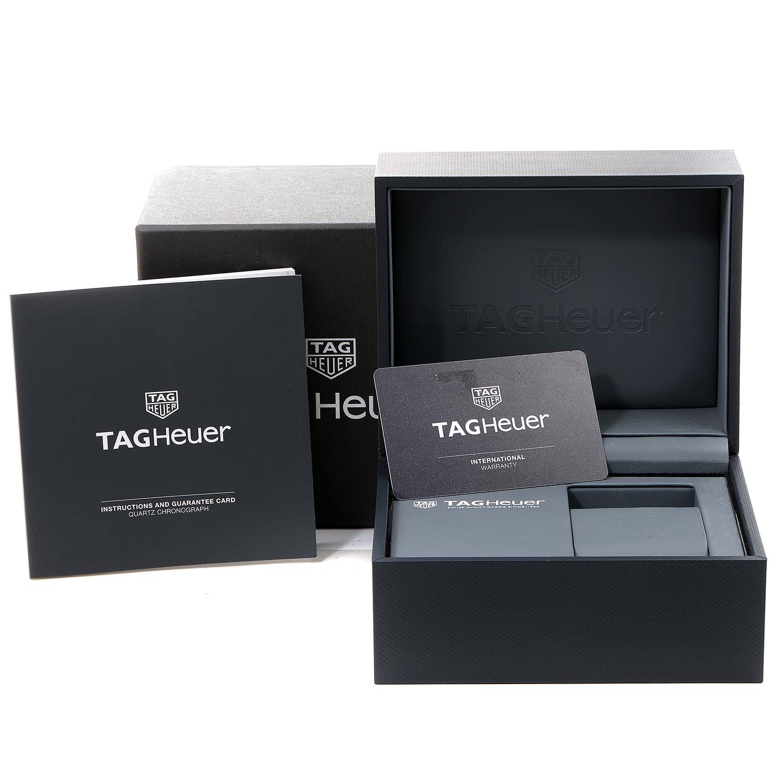 The image shows the watch accessories for the Tag Heuer Aquaracer CAY111B.BA0927 Men's Stainless Steel Blue Dial CAY111B.BA0927 Men's Stainless Steel Blue Dial, including the box, instruction manual, and warranty card.