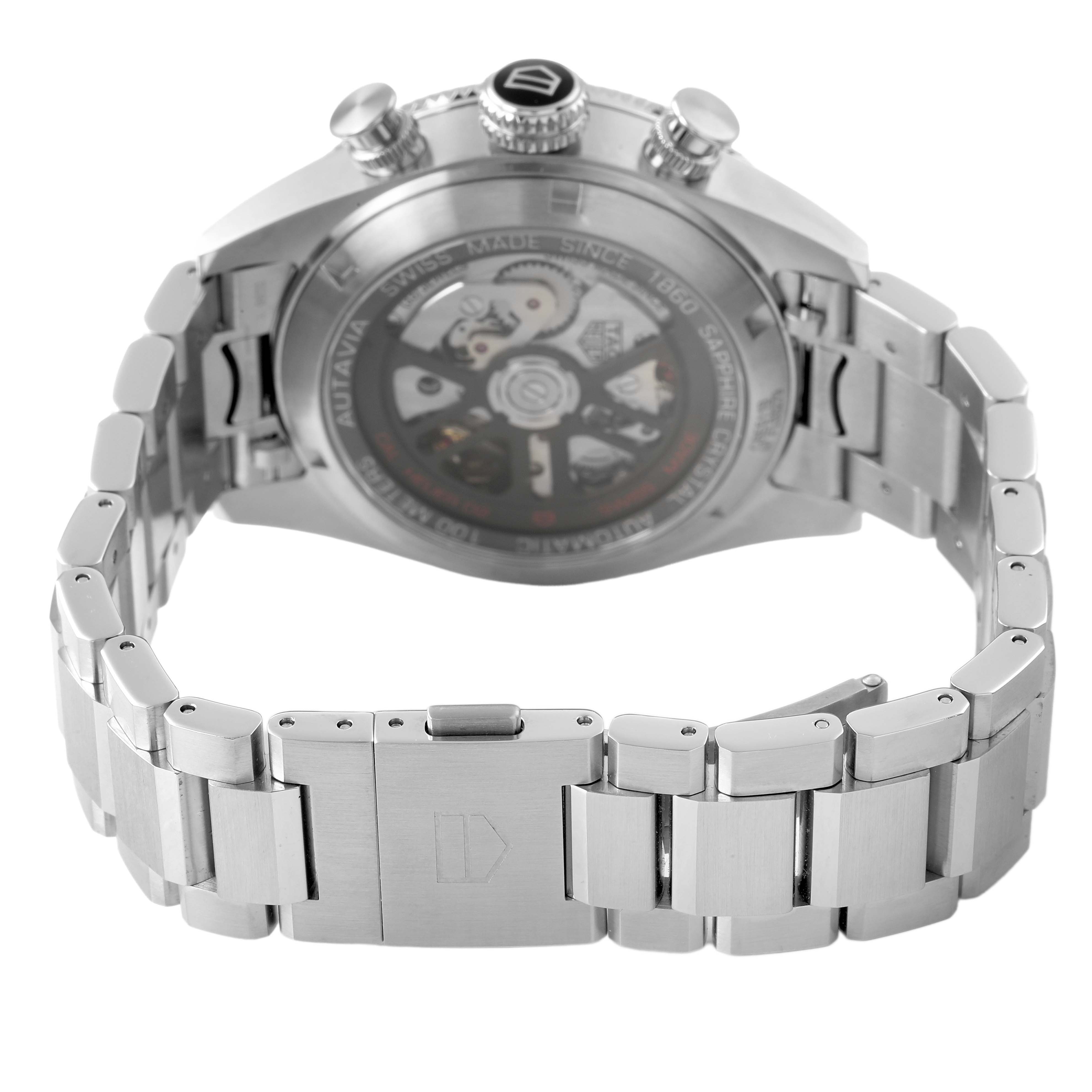 The image shows the back view of a Tag Heuer Autavia CBE511B Men's Stainless Steel Silver Dial watch, highlighting the open case back and metal bracelet.