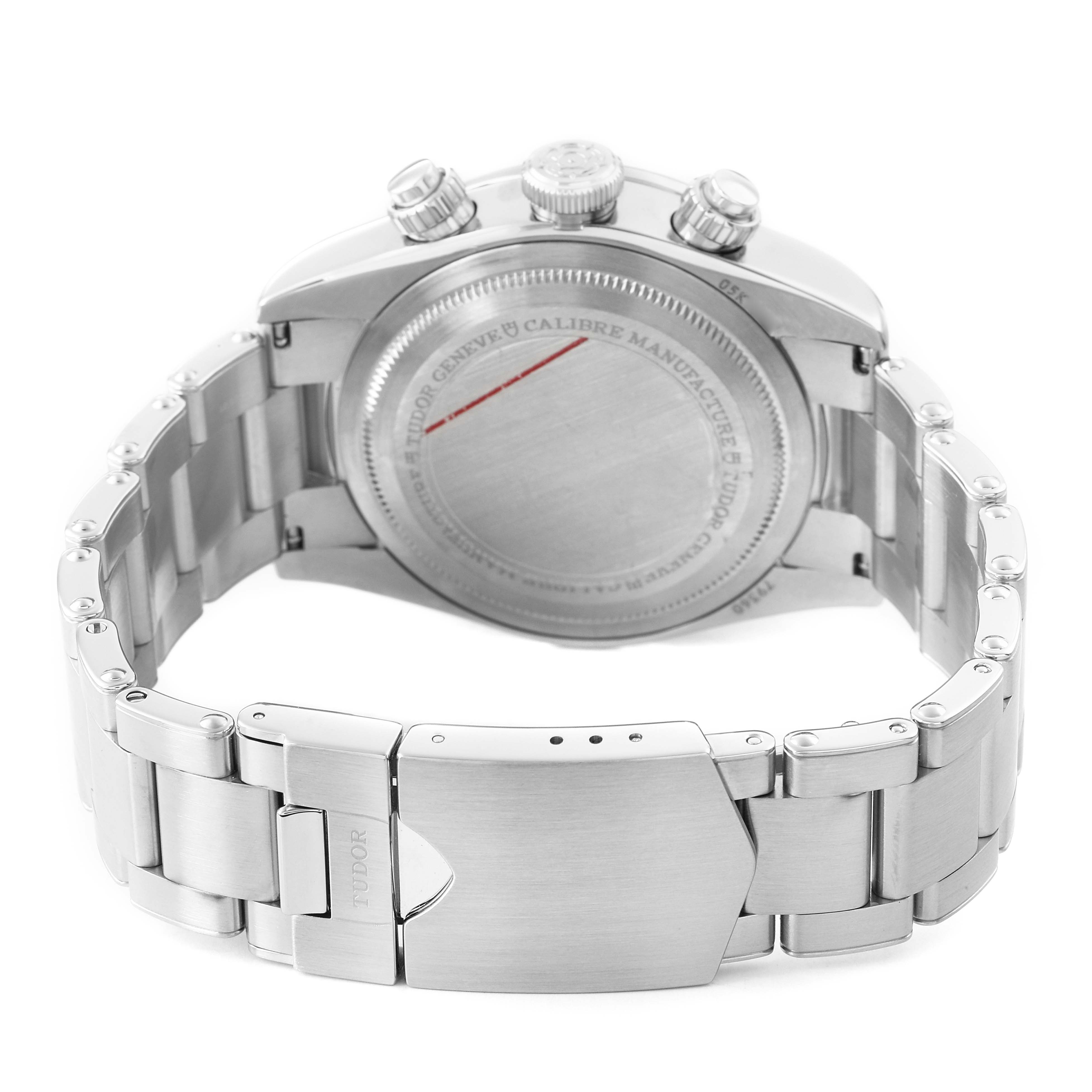 The image shows the back of the Tudor Heritage Chrono 79360N Men's Stainless Steel Black Dial, highlighting its case back, clasp, and bracelet from a rear angle.