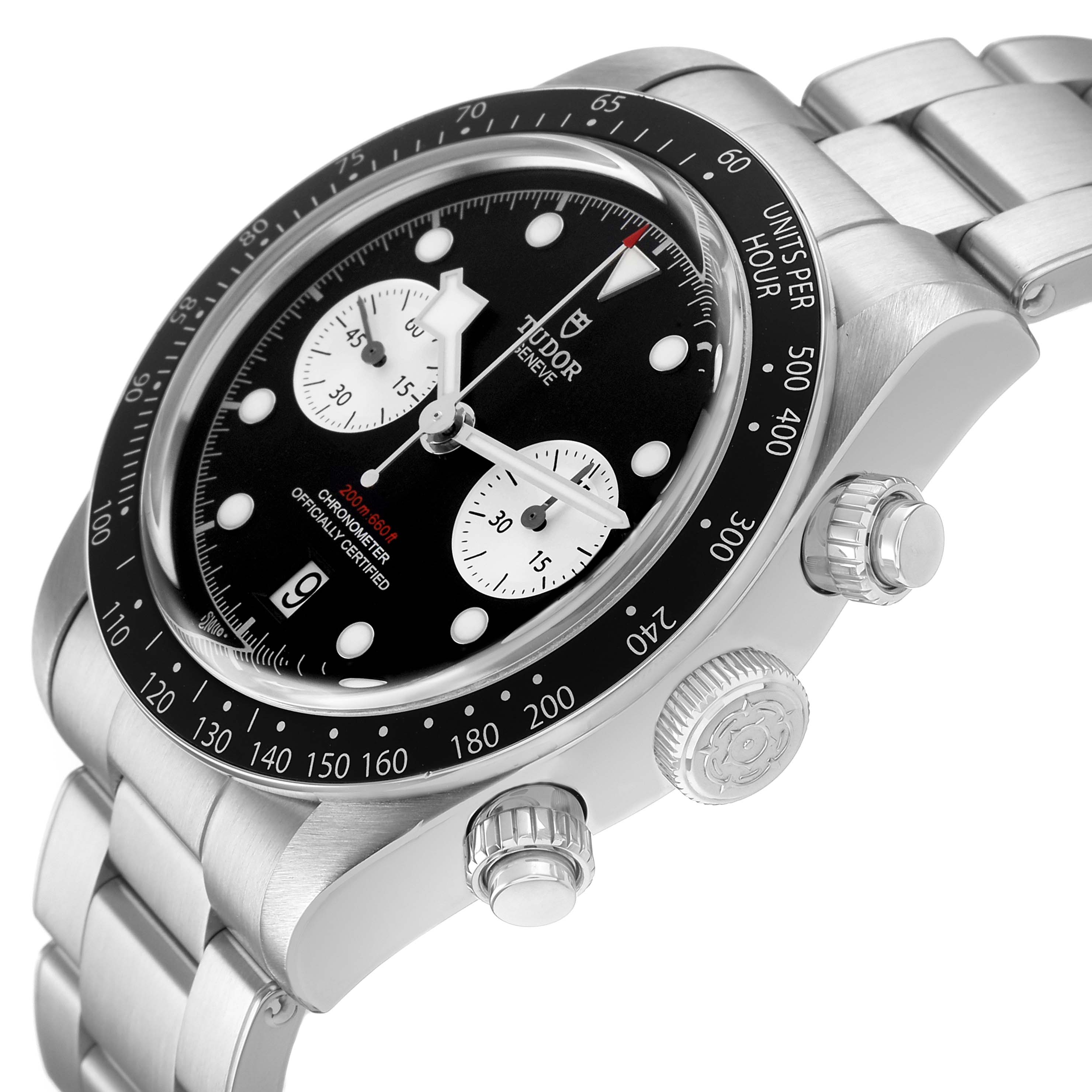 The Tudor Heritage Chrono 79360N Men's Stainless Steel Black Dial watch is shown from an angled side view, highlighting the dial, bezel, crown, and bracelet.