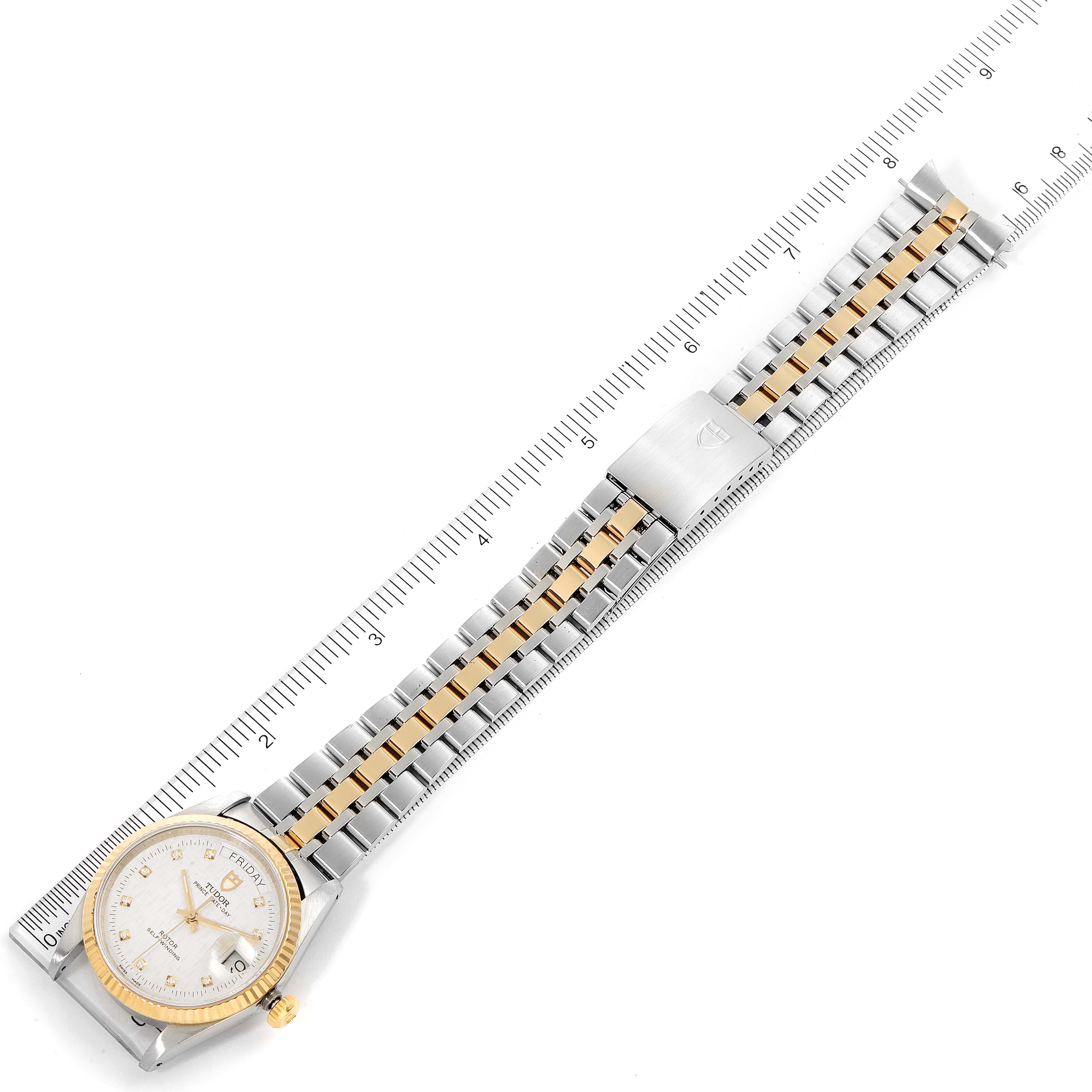 The image shows the Tudor Prince 76213 Men's Steel and Gold (two tone) Silver Dial 76213 Men's Steel and Gold (two tone) Silver Dial model watch laid flat with its bracelet fully extended alongside a ruler for measurement.