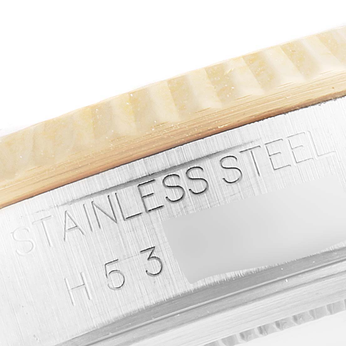 This image shows a close-up of the side of a Tudor Prince 76213 Men's Steel and Gold (two tone) Silver Dial 76213 Men's Steel and Gold (two tone) Silver Dial watch, focusing on the stainless steel bezel and engravings.