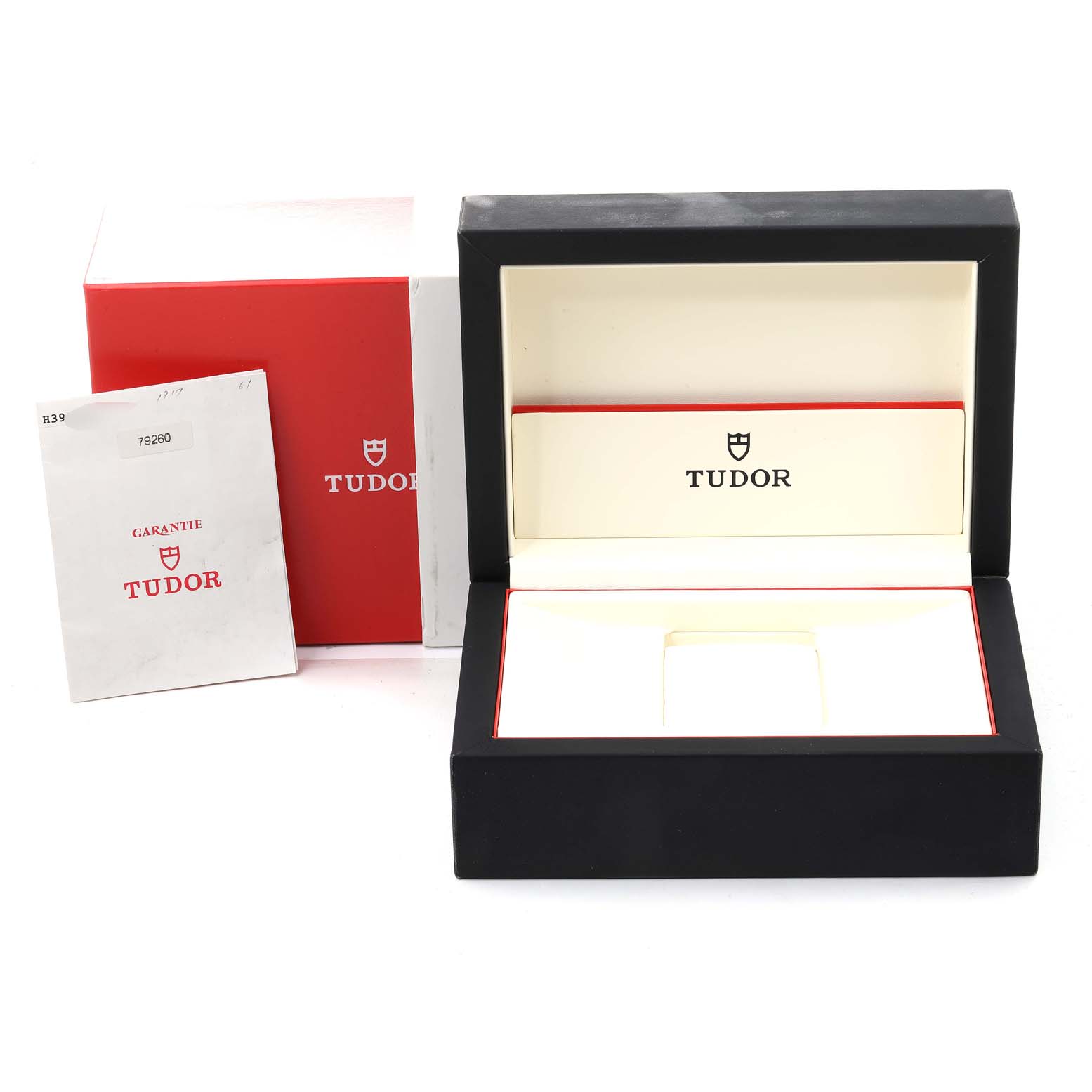 This image shows the open packaging, box, and guarantee card for the Tudor Prince 79260 Men
s Stainless Steel Black Dial 79260 Men
s Stainless Steel Black Dial model watch.