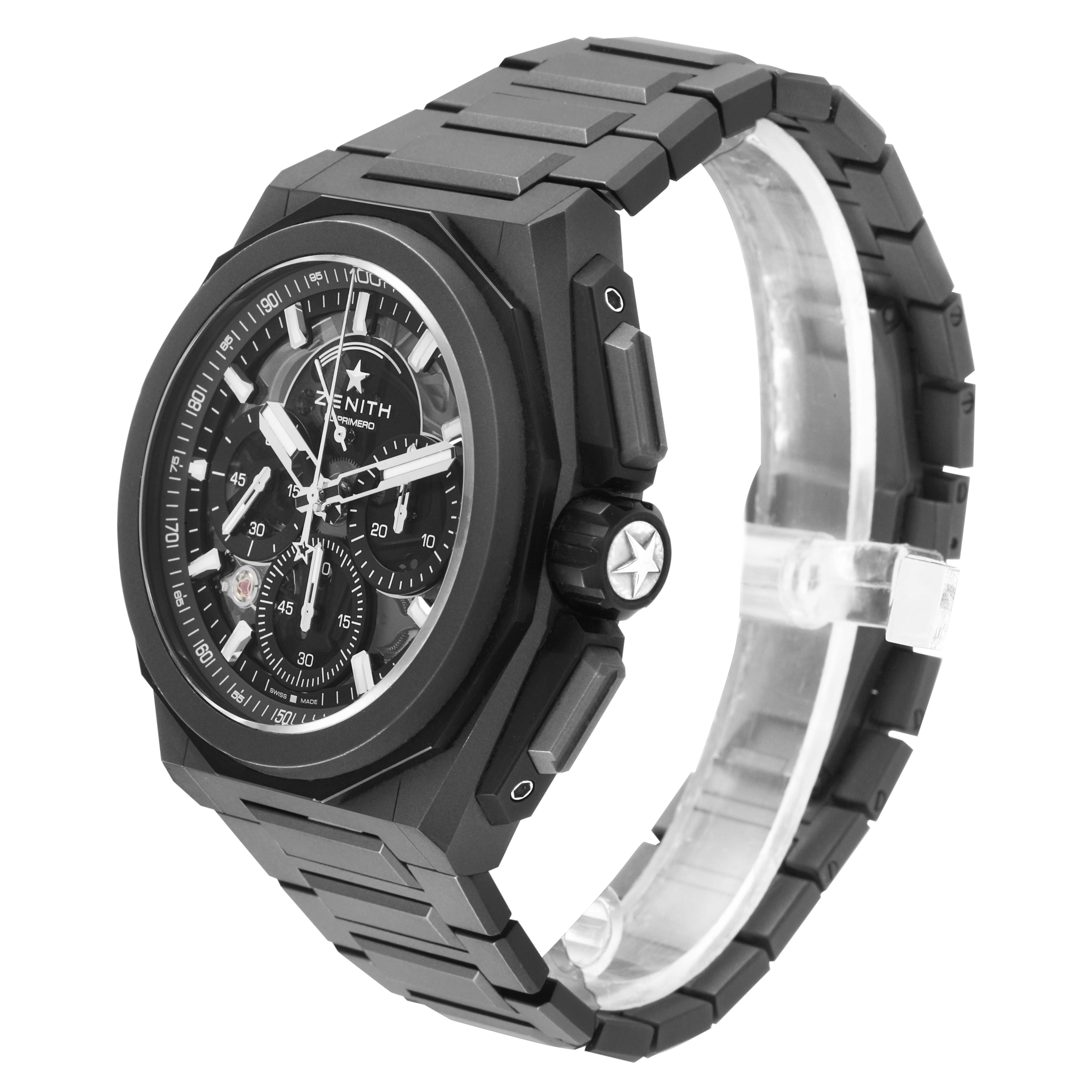 The Zenith Defy 97.9100.9004 Men's Titanium Grey Dial watch is shown at a side angle, highlighting its black case, dial, crown, and bracelet.