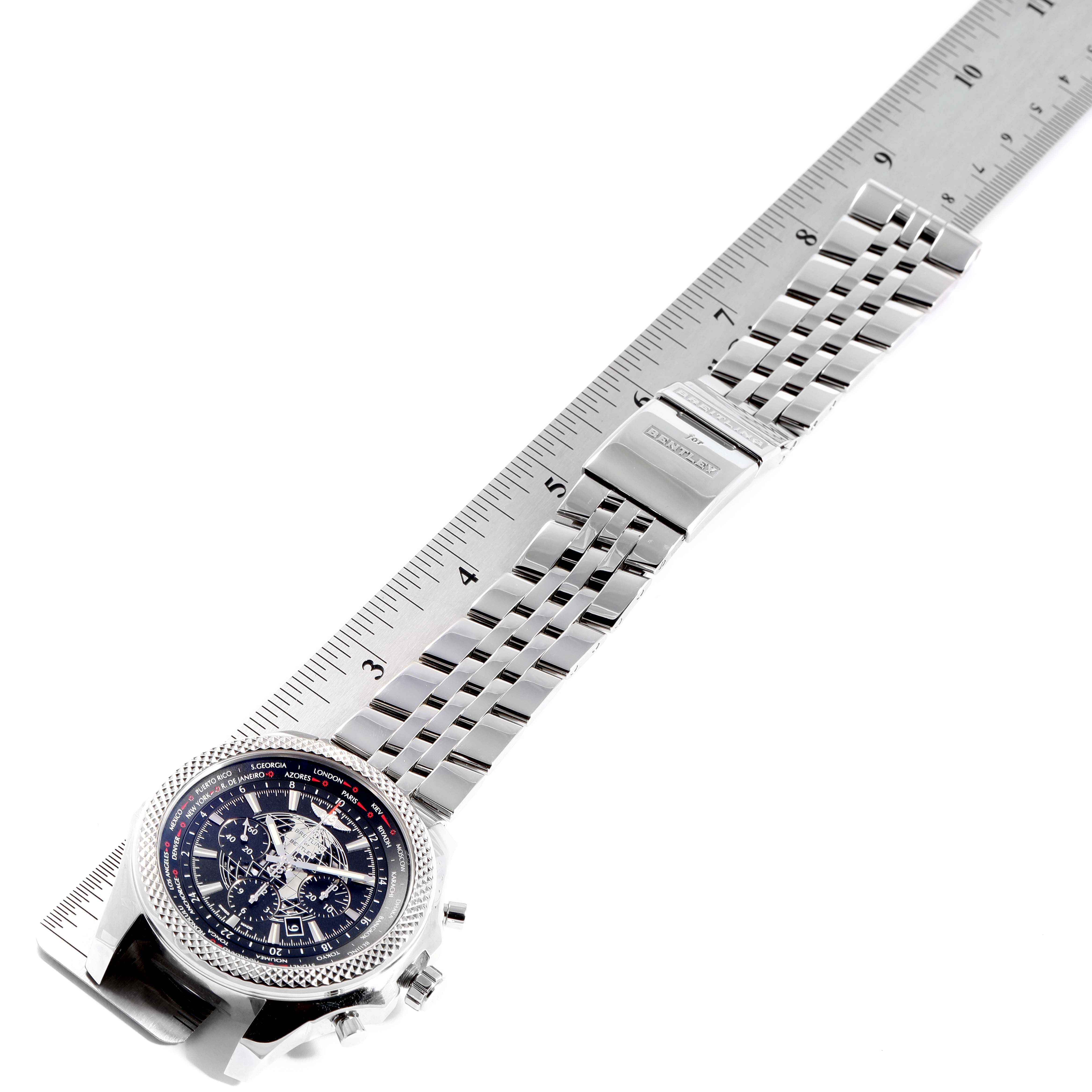 The image shows a Breitling Bentley AB0521U4/BC65 Men's Stainless Steel Black Dial AB0521U4/BC65 Men's Stainless Steel Black Dial watch lying flat, with a ruler beside it to measure the stainless steel bracelet length.
