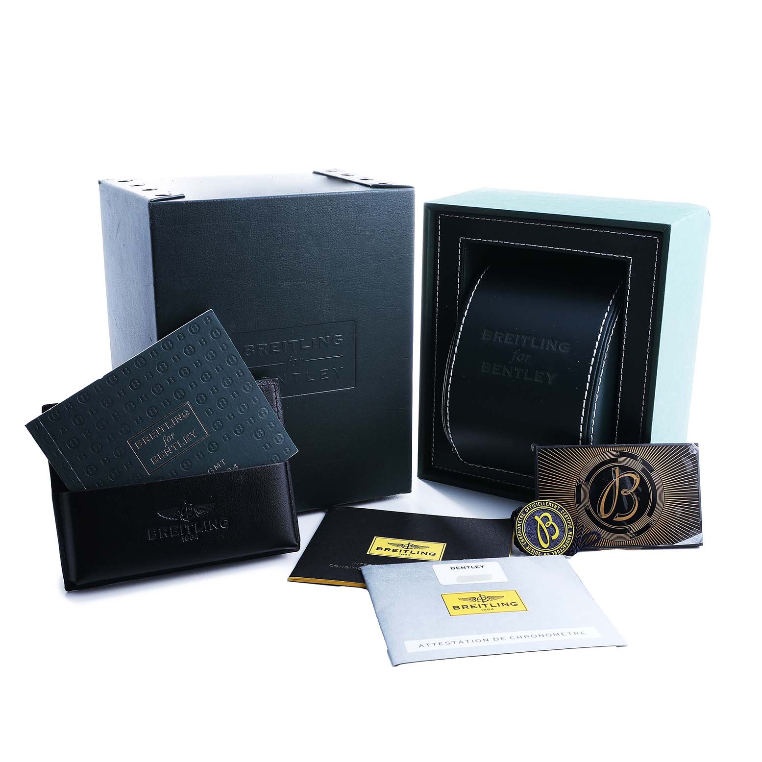 The image shows a Breitling for Bentley watch box and accessories, including manuals, cards, and a pouch, from a front angle.