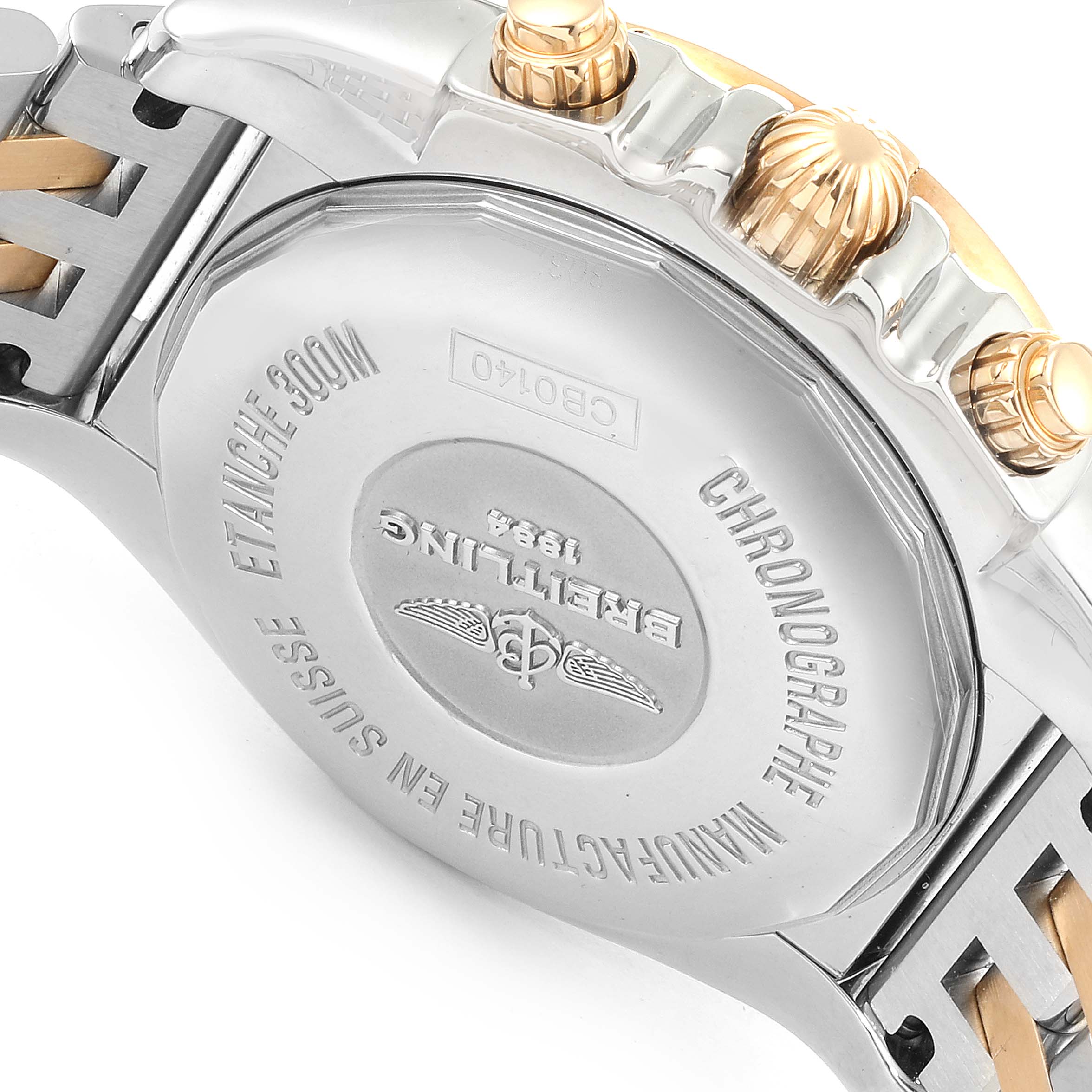 This image shows the case back, crown, and pushers of the Breitling Chronomat CB014012/A723 Men's Steel and Gold (two tone) Mother of Pearl Dial CB014012/A723 Men's Steel and Gold (two tone) Mother of Pearl Dial watch from an angled view.