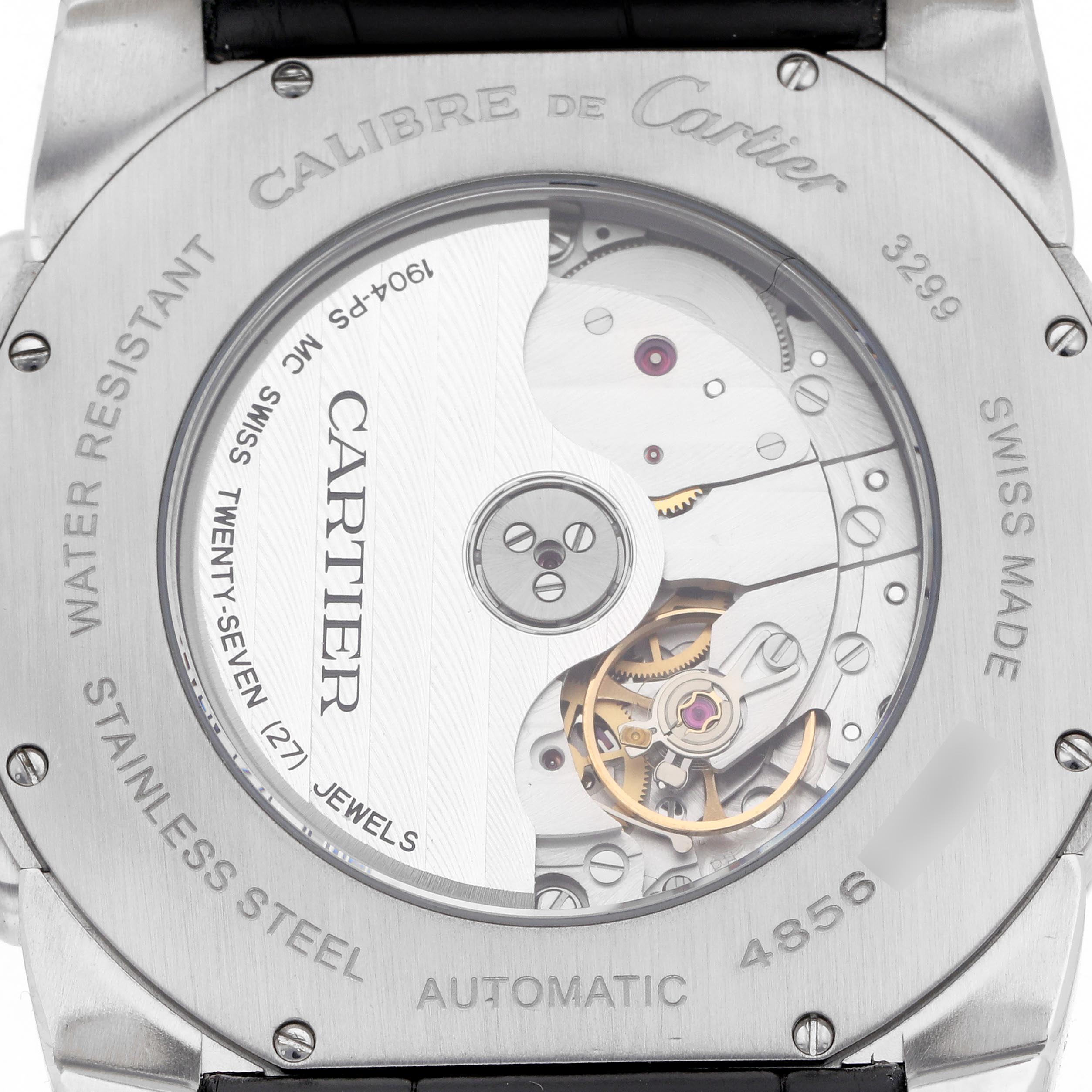 The image shows the back view of a Calibre de Cartier watch, highlighting the automatic movement and intricate internal mechanics.