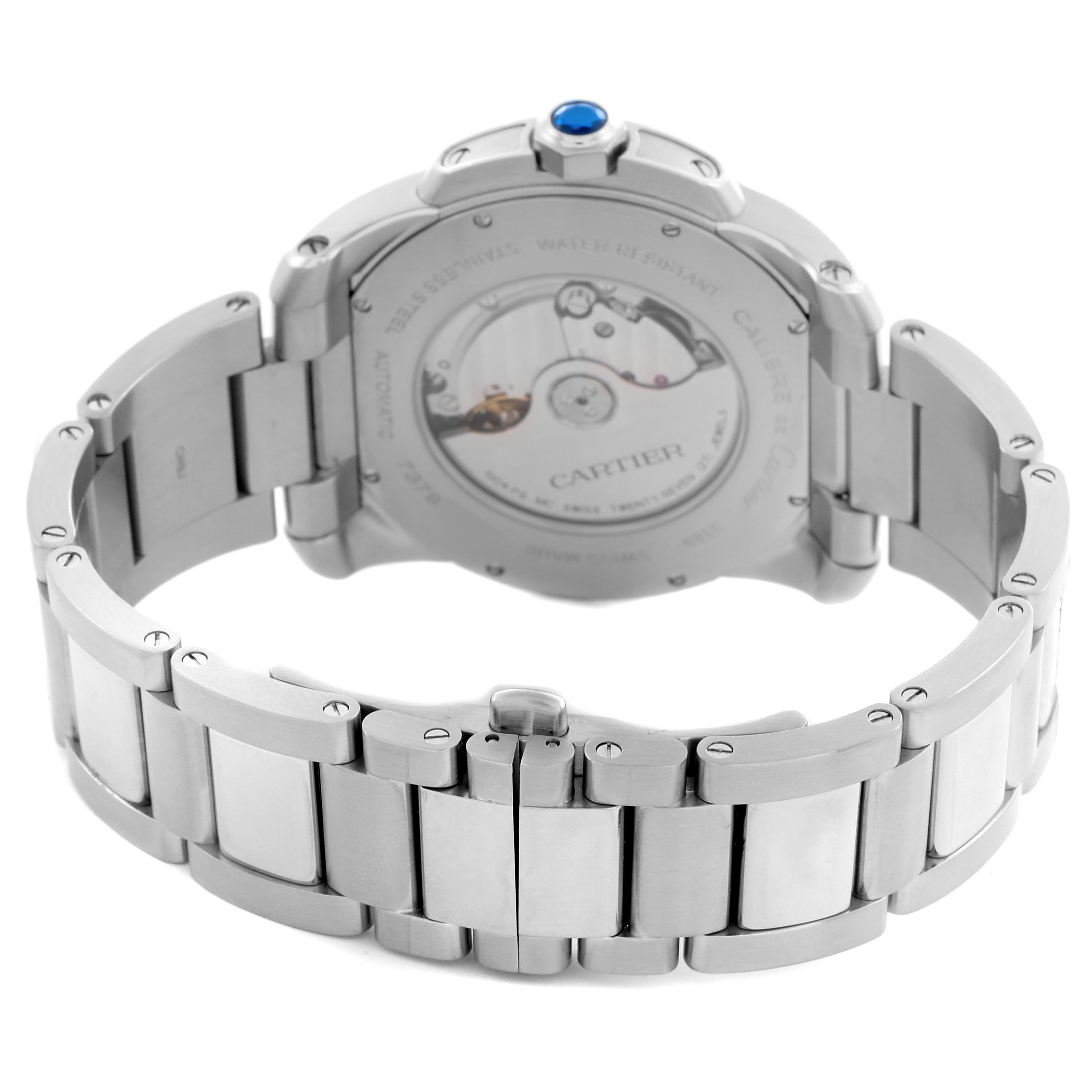 The image shows the back view of a Calibre de Cartier watch, highlighting the stainless steel bracelet and the automatic movement.