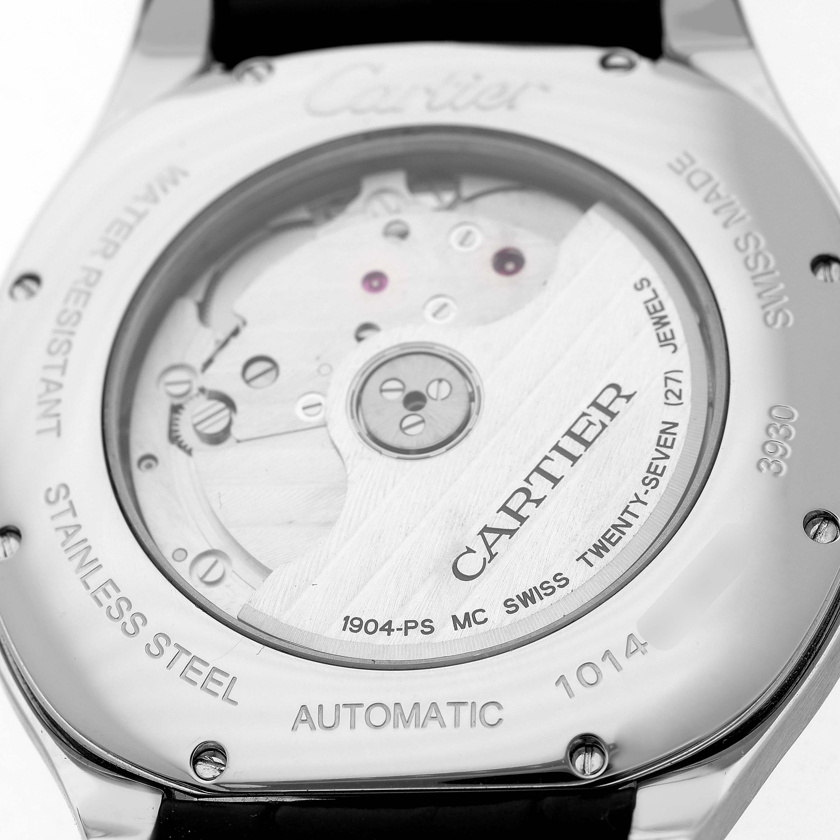 The image shows the back of the Drive de Cartier watch, highlighting its automatic movement and engravings on the stainless steel case.