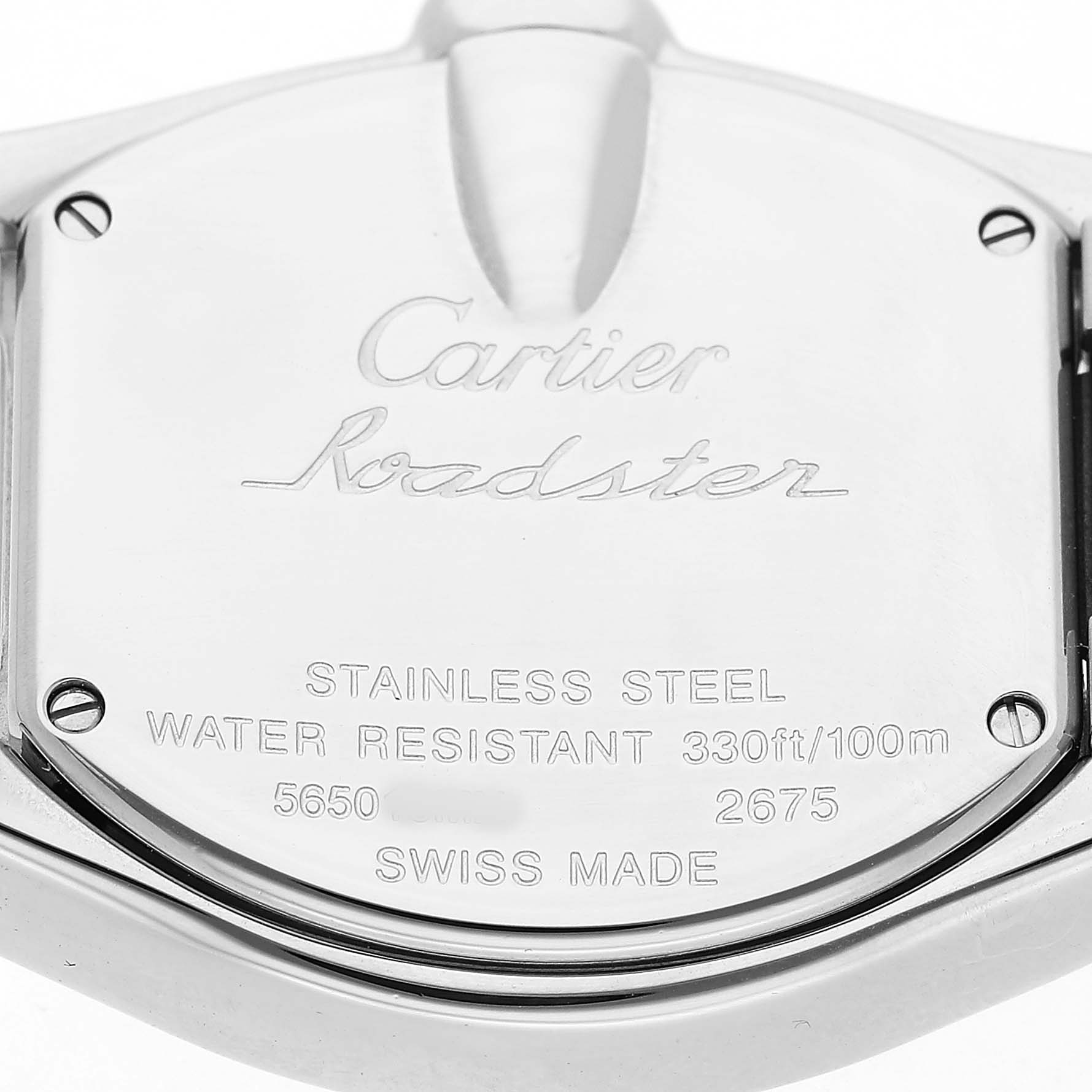 The image shows the back of a Cartier Roadster W62017V3 Women's Stainless Steel Pink Dial watch, highlighting the stainless steel case and engraved details.