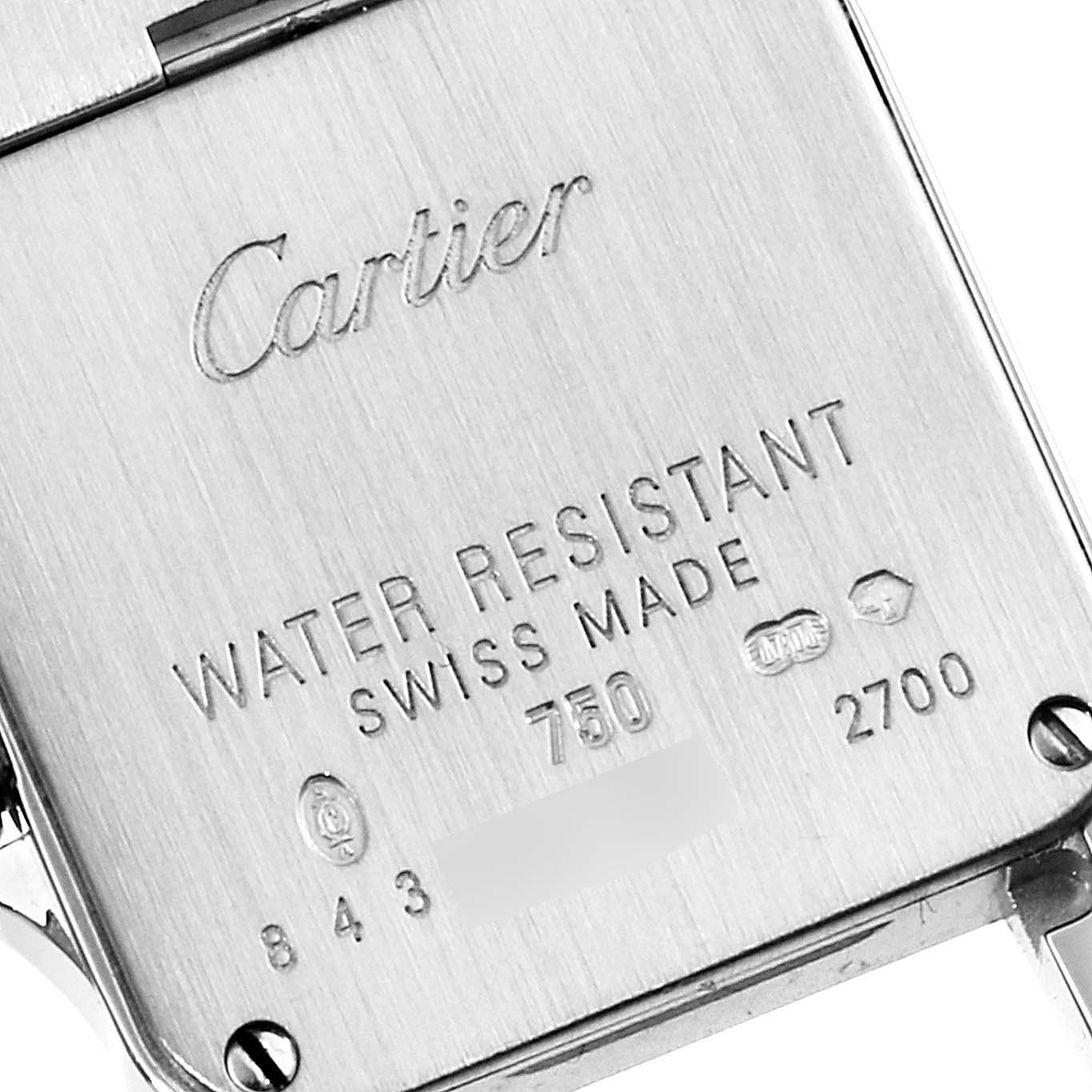 This image shows the back case of a Cartier Santos Demoiselle WF9003YC Women's White Gold Silver Dial WF9003YC Women's White Gold Silver Dial watch, featuring its engraved details.