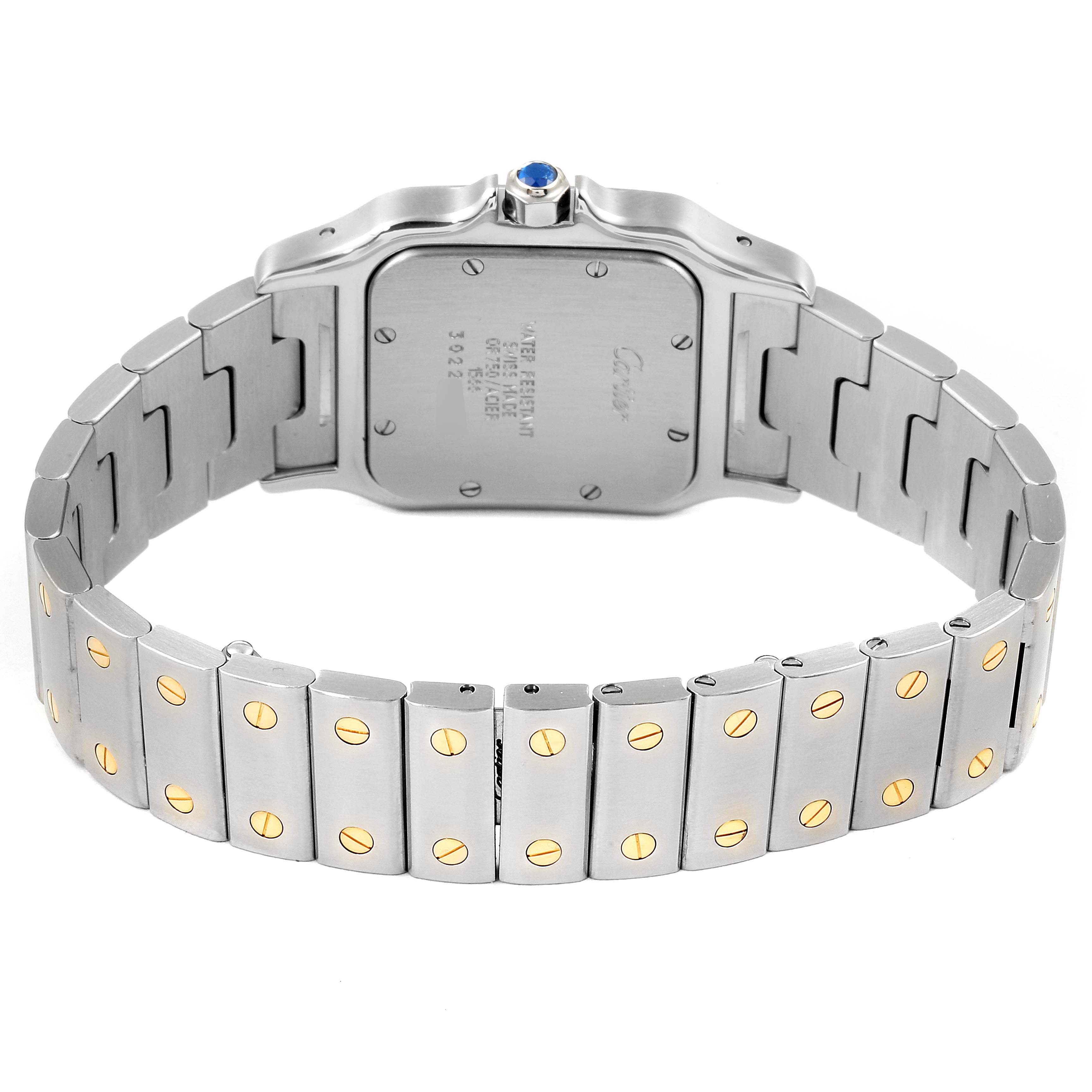 The image shows the back view of a Santos model watch by Cartier, focusing on the bracelet and case back.