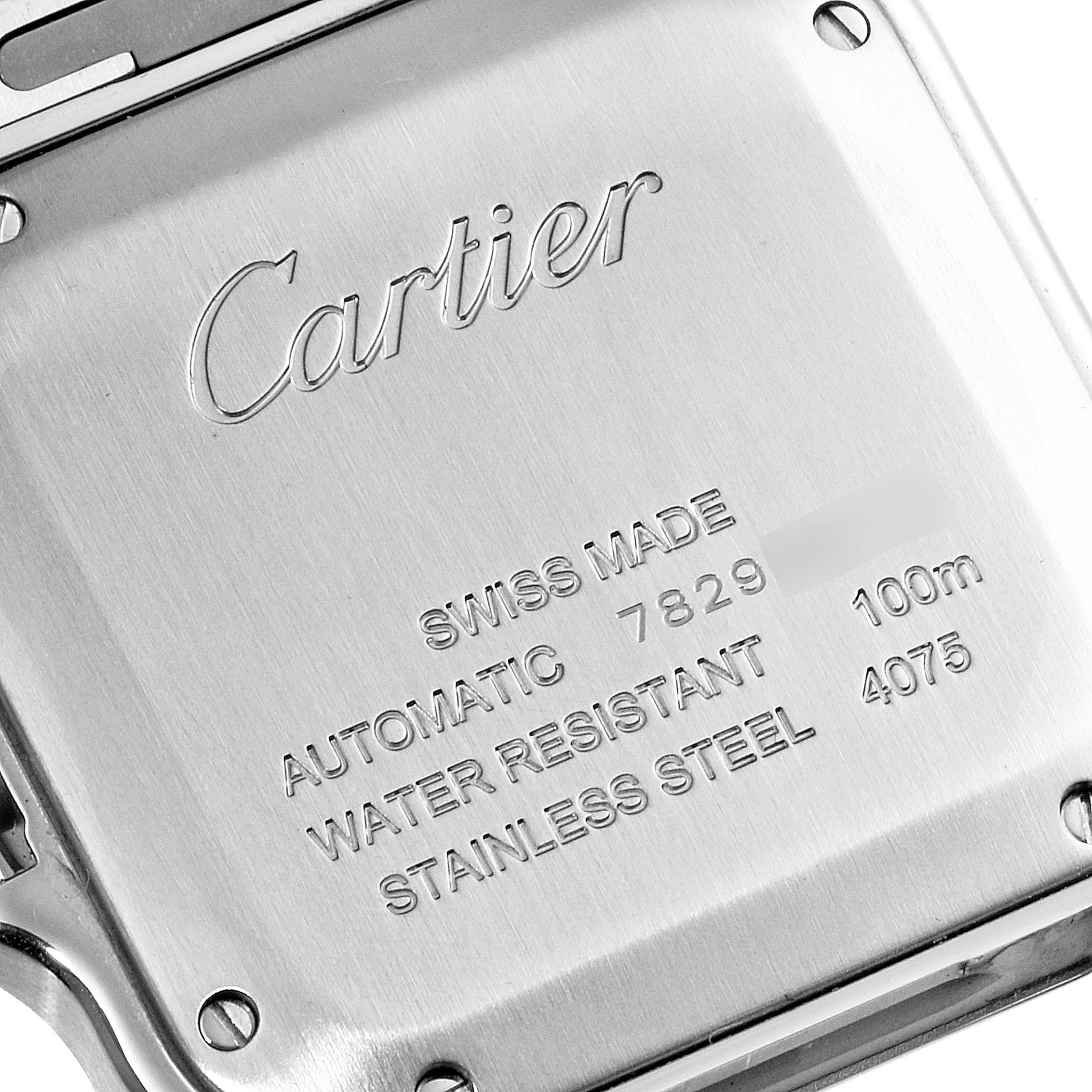 This is a close-up view of the back case of the Cartier Santos W2SA0007 Men
s Steel and Gold (two tone) Silver Dial W2SA0007 Men
s Steel and Gold (two tone) Silver Dial watch, showing its engraved details and screws.