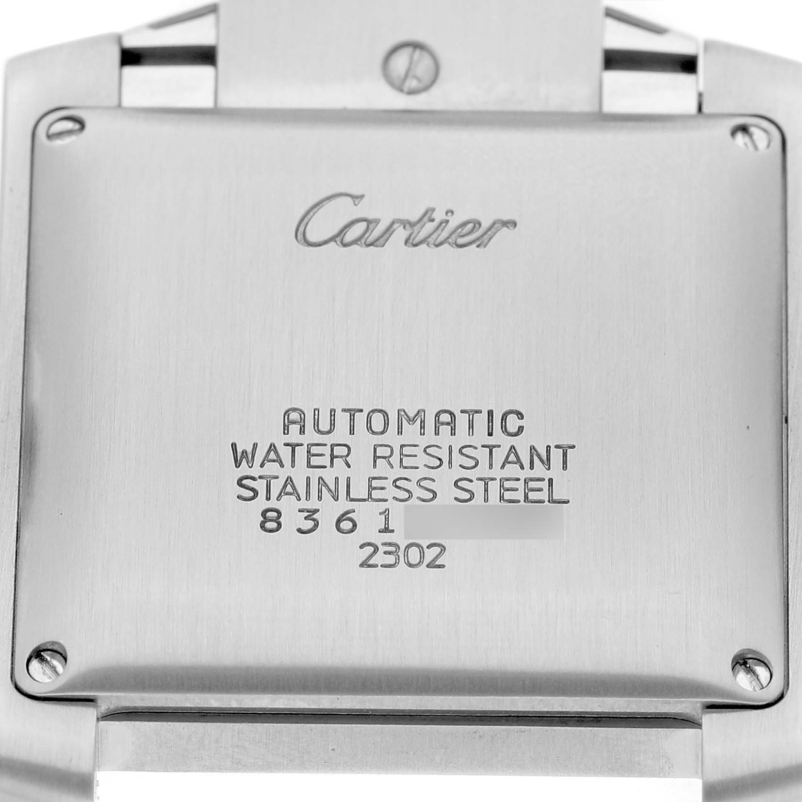 The image shows the case back of a Cartier Tank Française watch, featuring engraved details and screws.