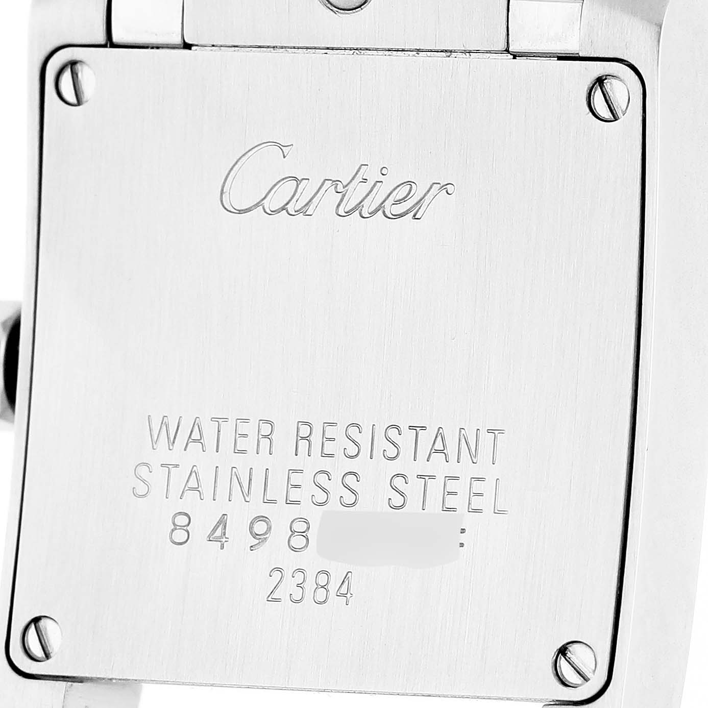 The image shows the back case of a Cartier Tank Francaise W51028Q3 Women's Stainless Steel Mother of Pearl Dial watch, highlighting the brand engraving and water resistance details.