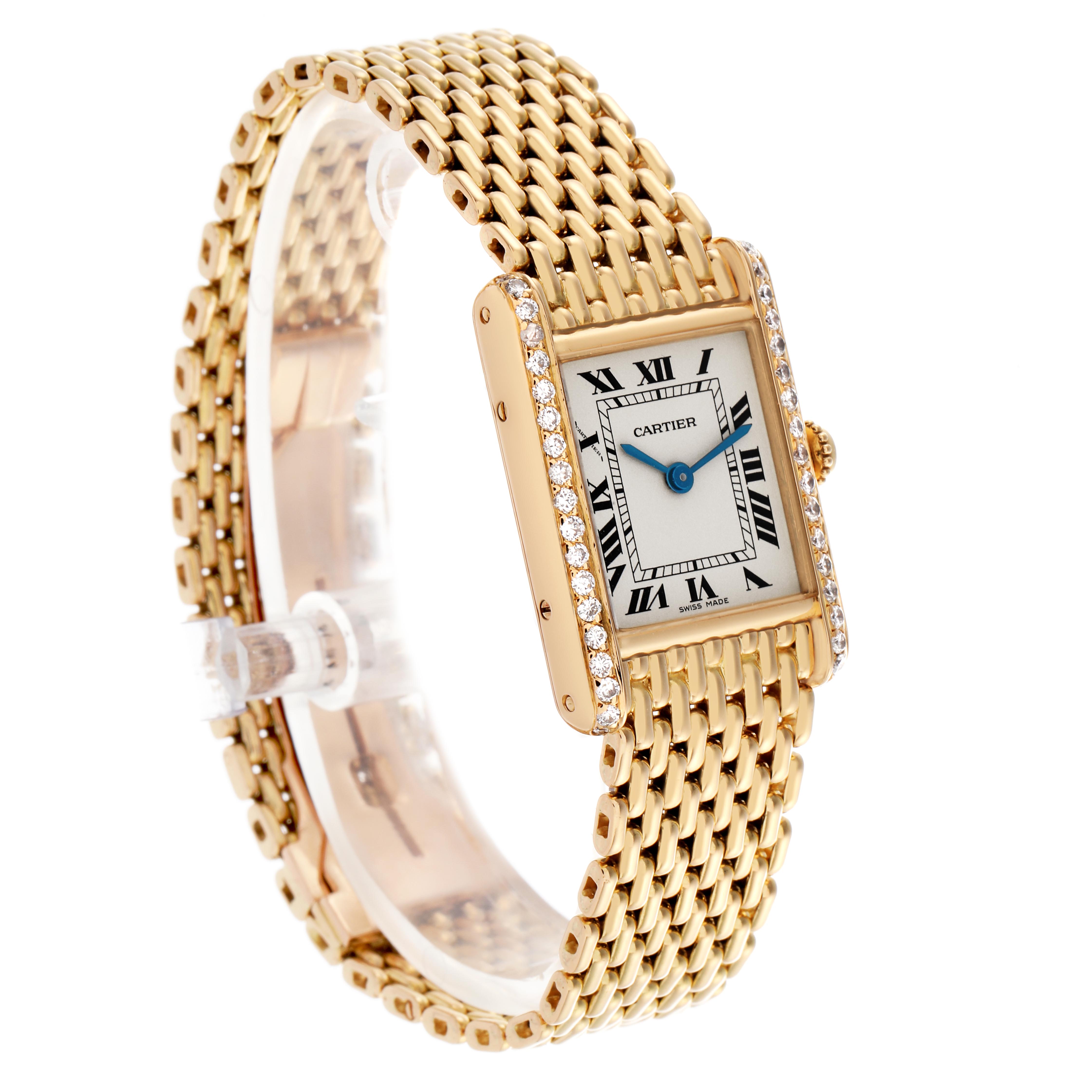 The Cartier Tank Louis WA2005C7 / 1150 Women's Yellow Gold White Dial WA2005C7 / 1150 Women's Yellow Gold White Dial watch is shown at an angled side view, featuring its gold bracelet, rectangular face, and diamond-set bezel.