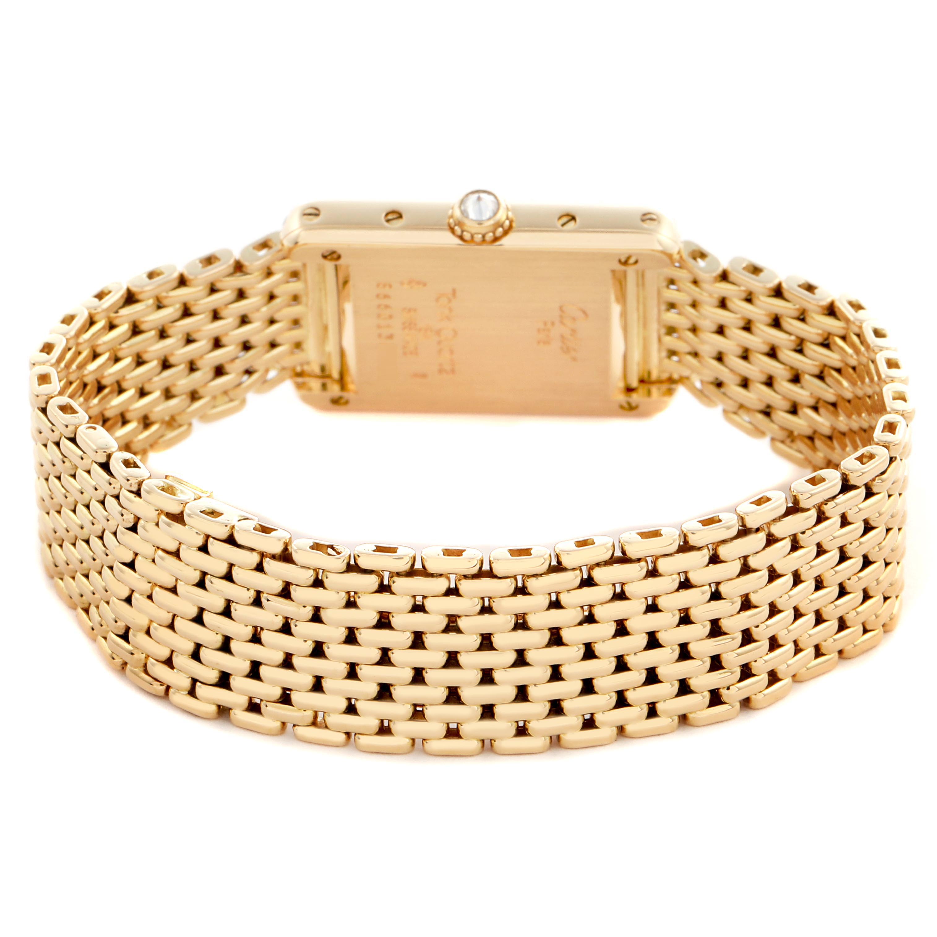 The Cartier Tank Louis WA2005C7 / 1150 Women's Yellow Gold White Dial WA2005C7 / 1150 Women's Yellow Gold White Dial watch is shown from the back, highlighting its gold bracelet and case.