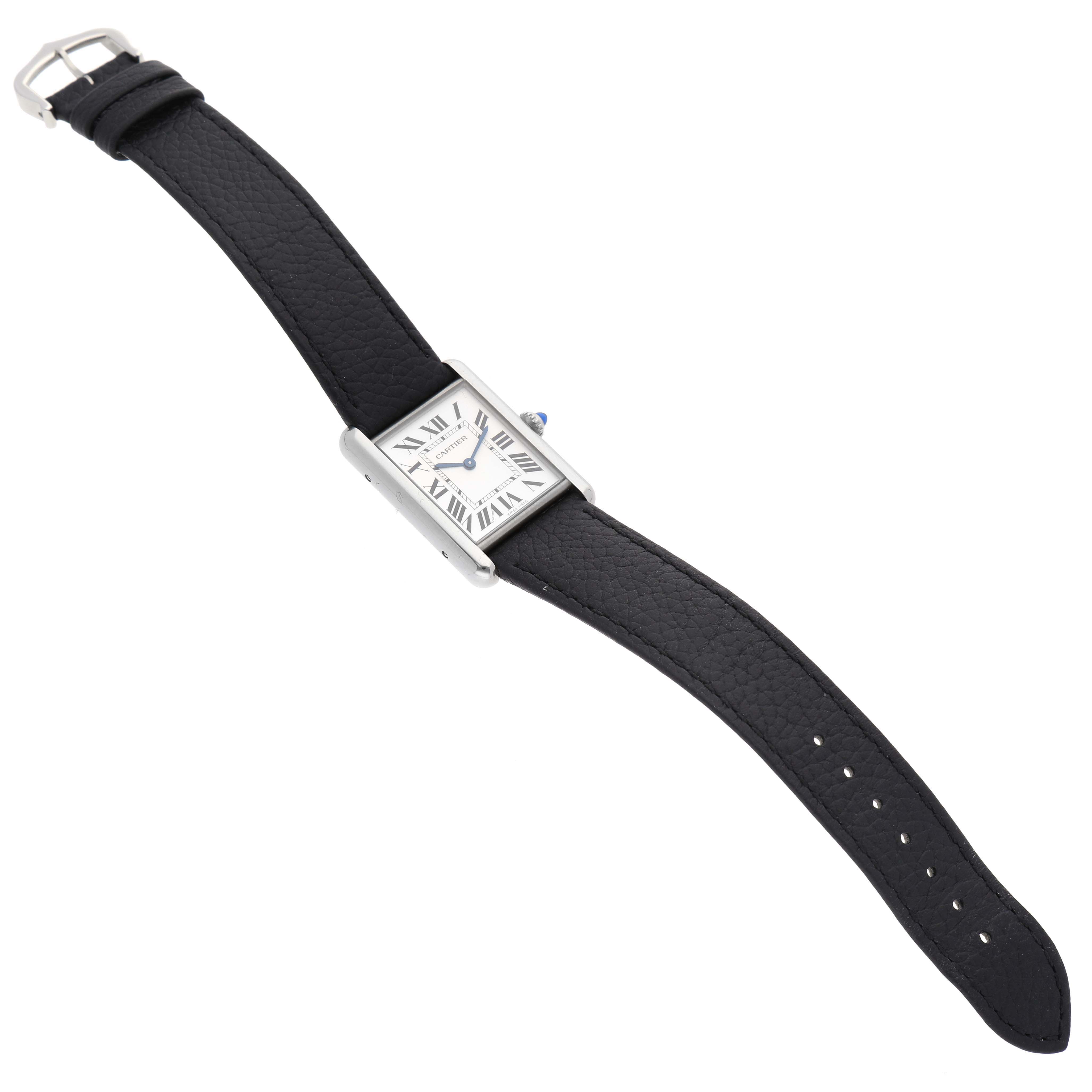 The image shows a full view of a Cartier Tank Must WSTA0041 Women's Stainless Steel Silver Dial WSTA0041 Women's Stainless Steel Silver Dial watch, displaying its rectangular dial, black strap, and silver buckle.