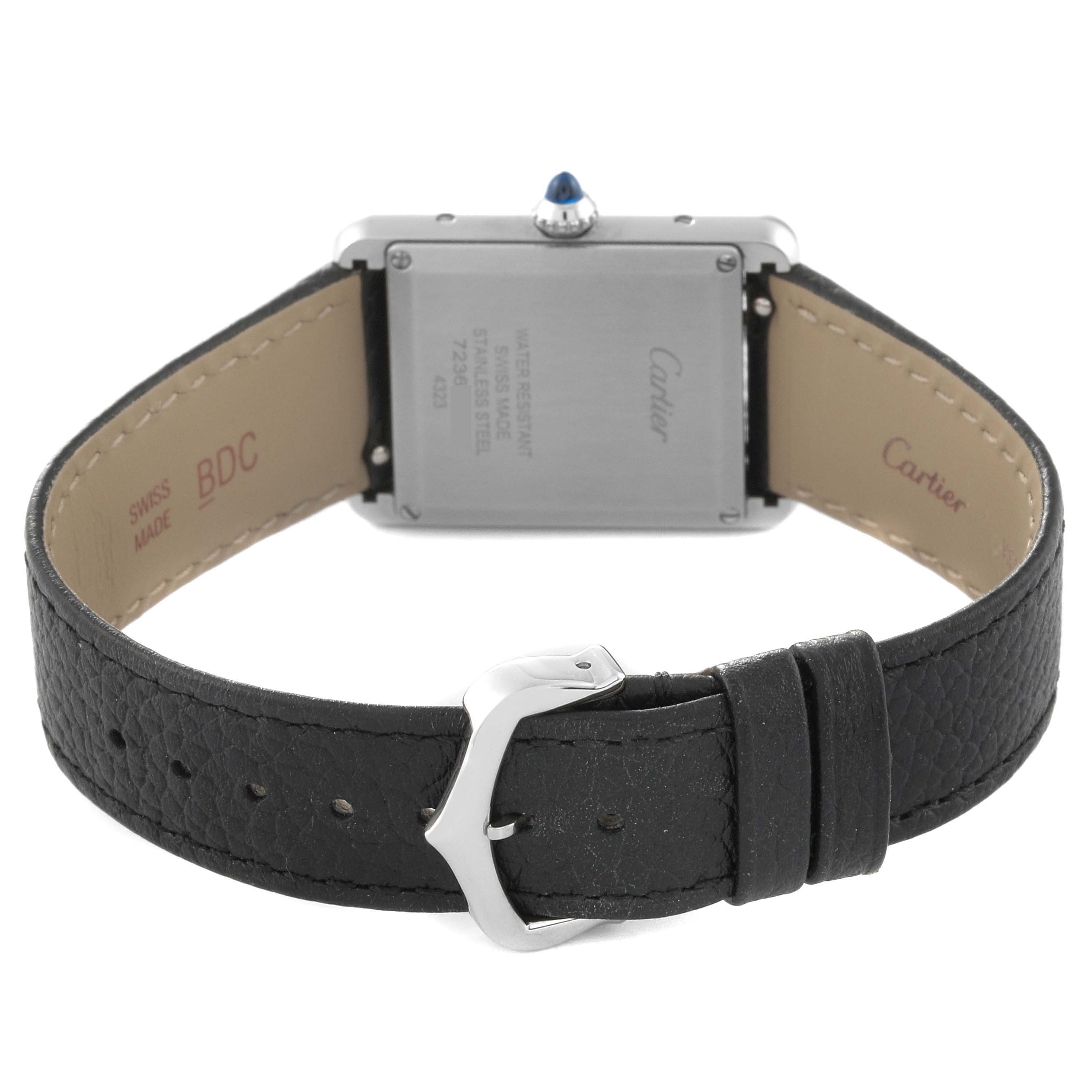 This image shows the back of a Cartier Tank Must WSTA0041 Women's Stainless Steel Silver Dial WSTA0041 Women's Stainless Steel Silver Dial watch, including its clasp, case back, and part of its leather strap.