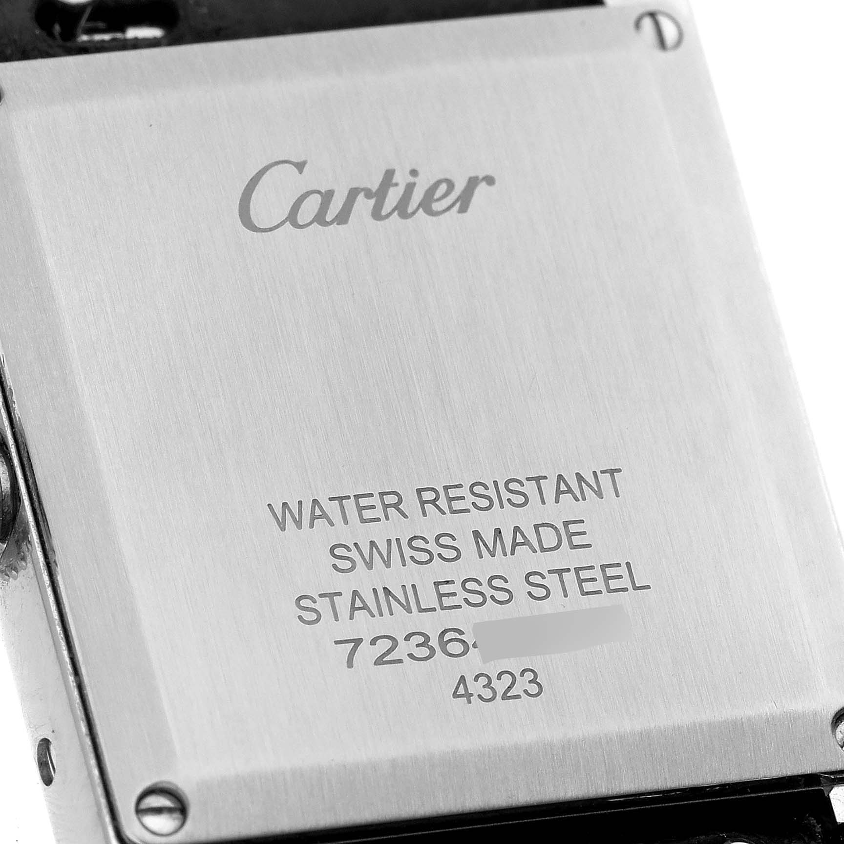 The image shows the back case of a Cartier Tank Must WSTA0041 Women's Stainless Steel Silver Dial WSTA0041 Women's Stainless Steel Silver Dial watch, highlighting its water resistance, material, and serial number.