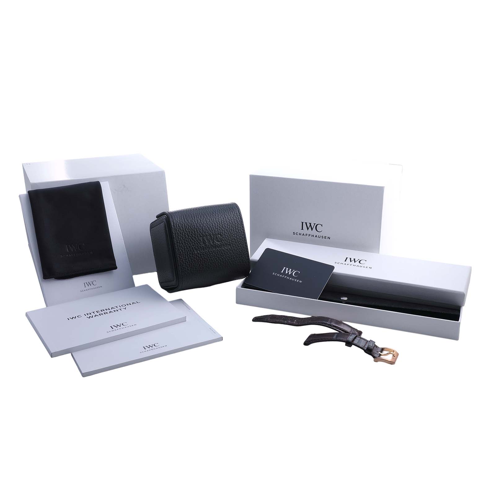 The image shows IWC Portuguese IW358306 Men's Rose Gold Silver Dial model accessories, including boxes, a strap, and booklets, all captured from a front angle.