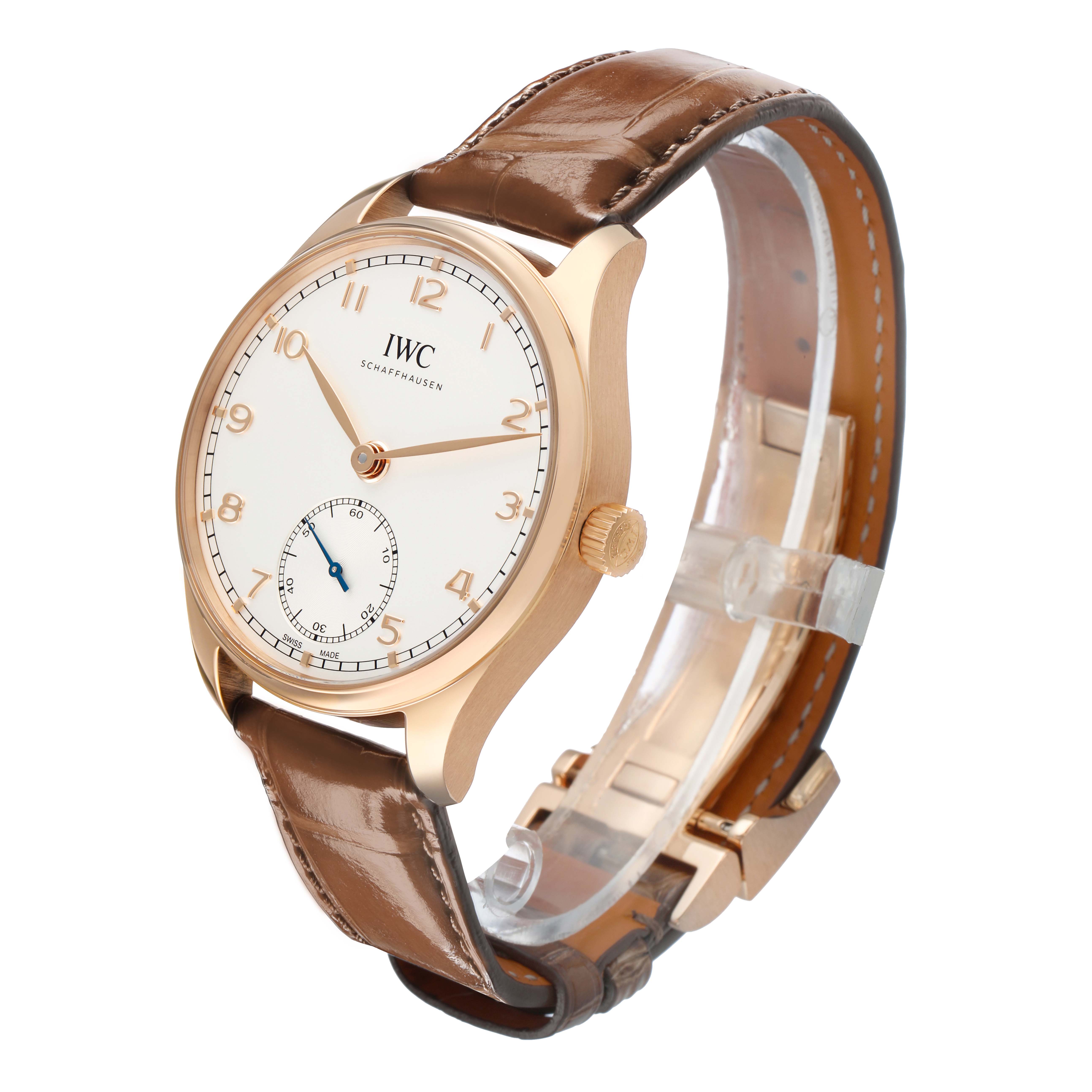 The IWC Portuguese IW358306 Men's Rose Gold Silver Dial watch is displayed at an angled view, highlighting its dial, case, crown, and leather strap.