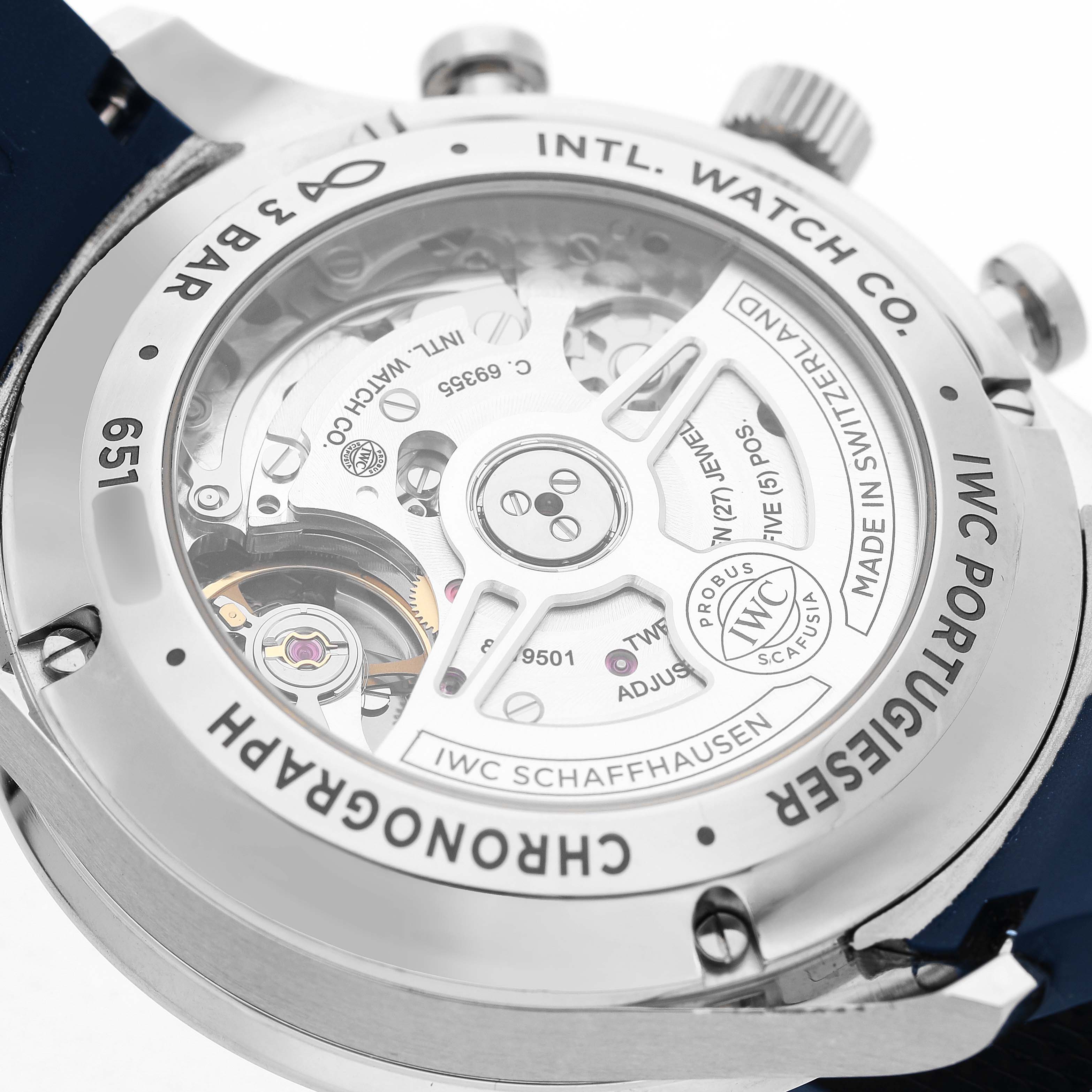 The image shows the back of the IWC Portuguese IW371605 Men's Stainless Steel Silver Dial chronograph, displaying the movement and inner mechanisms.