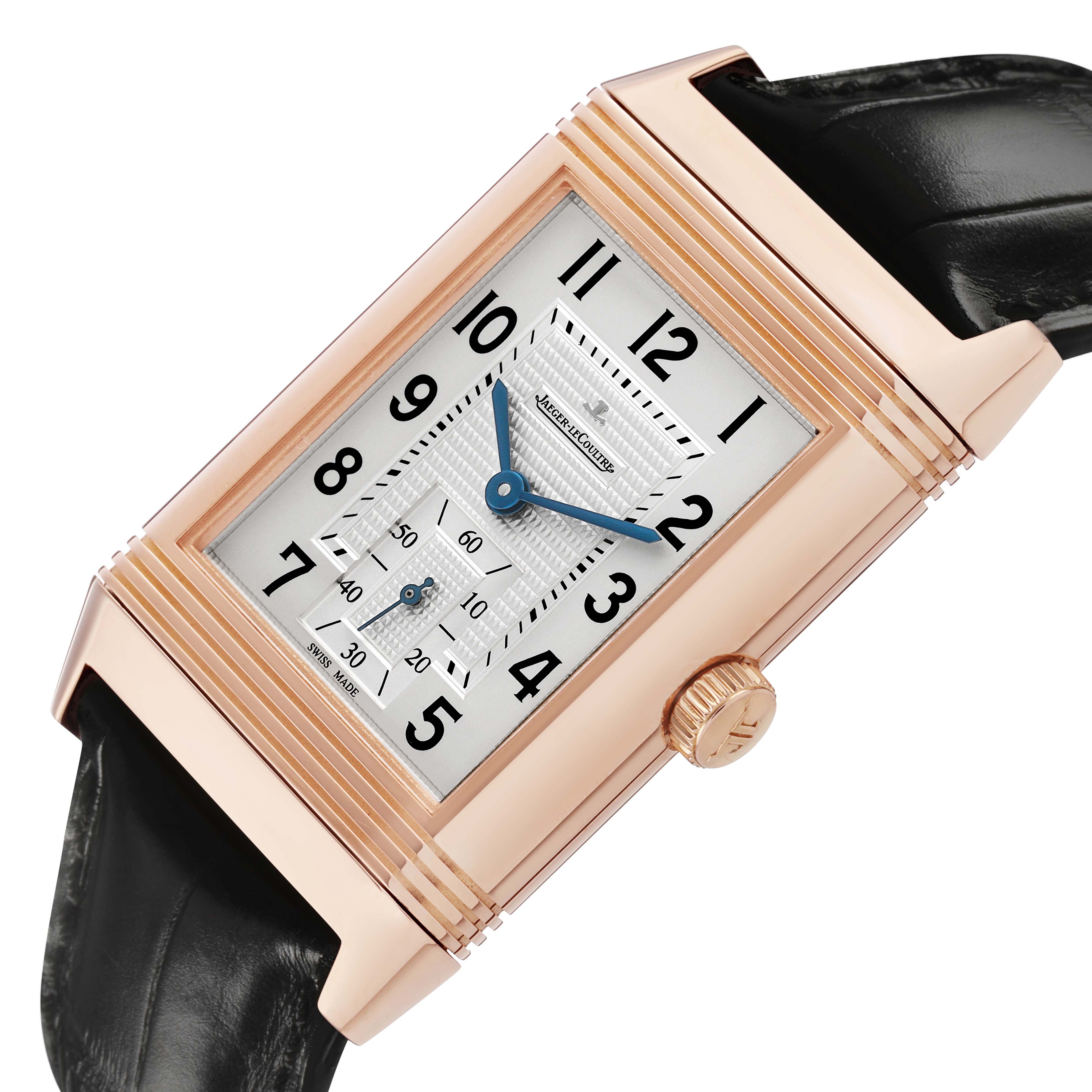 The Jaeger LeCoultre Reverso Q3732520 Men's Rose Gold Silver Dial watch is shown angled slightly, displaying its rose gold case, black strap, and detailed dial.