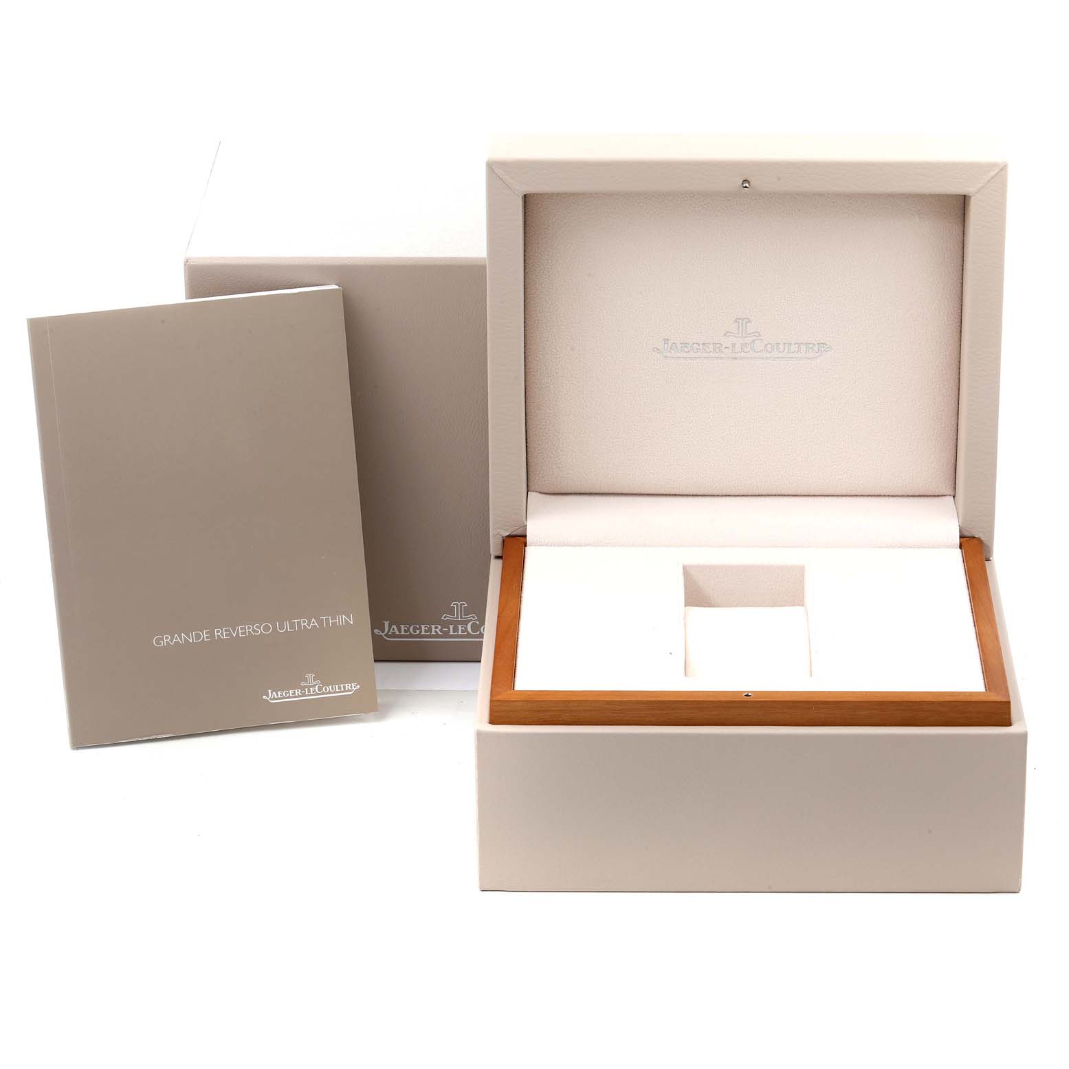 This image shows the Jaeger-LeCoultre Reverso watch box and accompanying booklet from a straight-on angle.