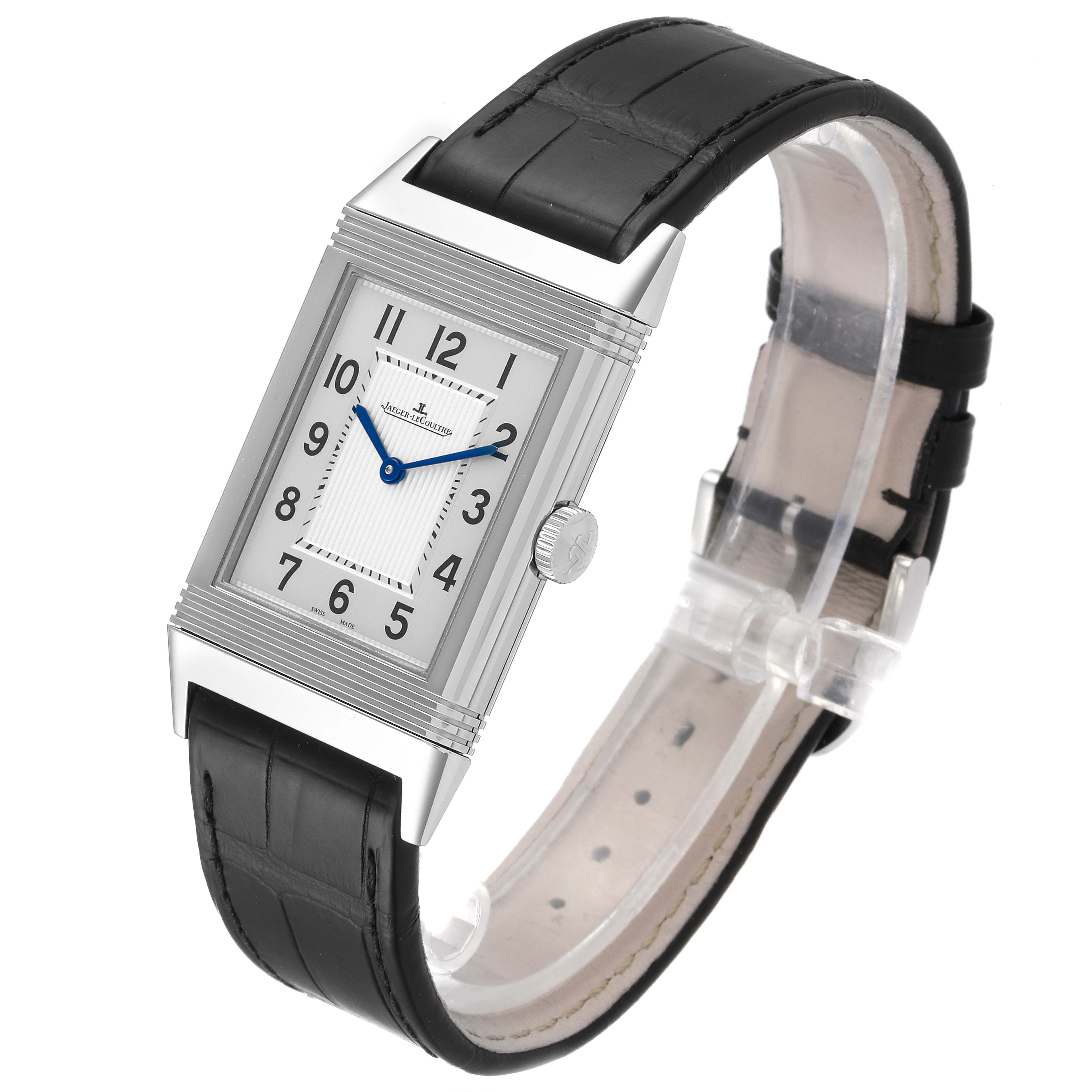 The image shows a Jaeger-LeCoultre Reverso watch at a three-quarter angle, highlighting its rectangular face and black leather strap.