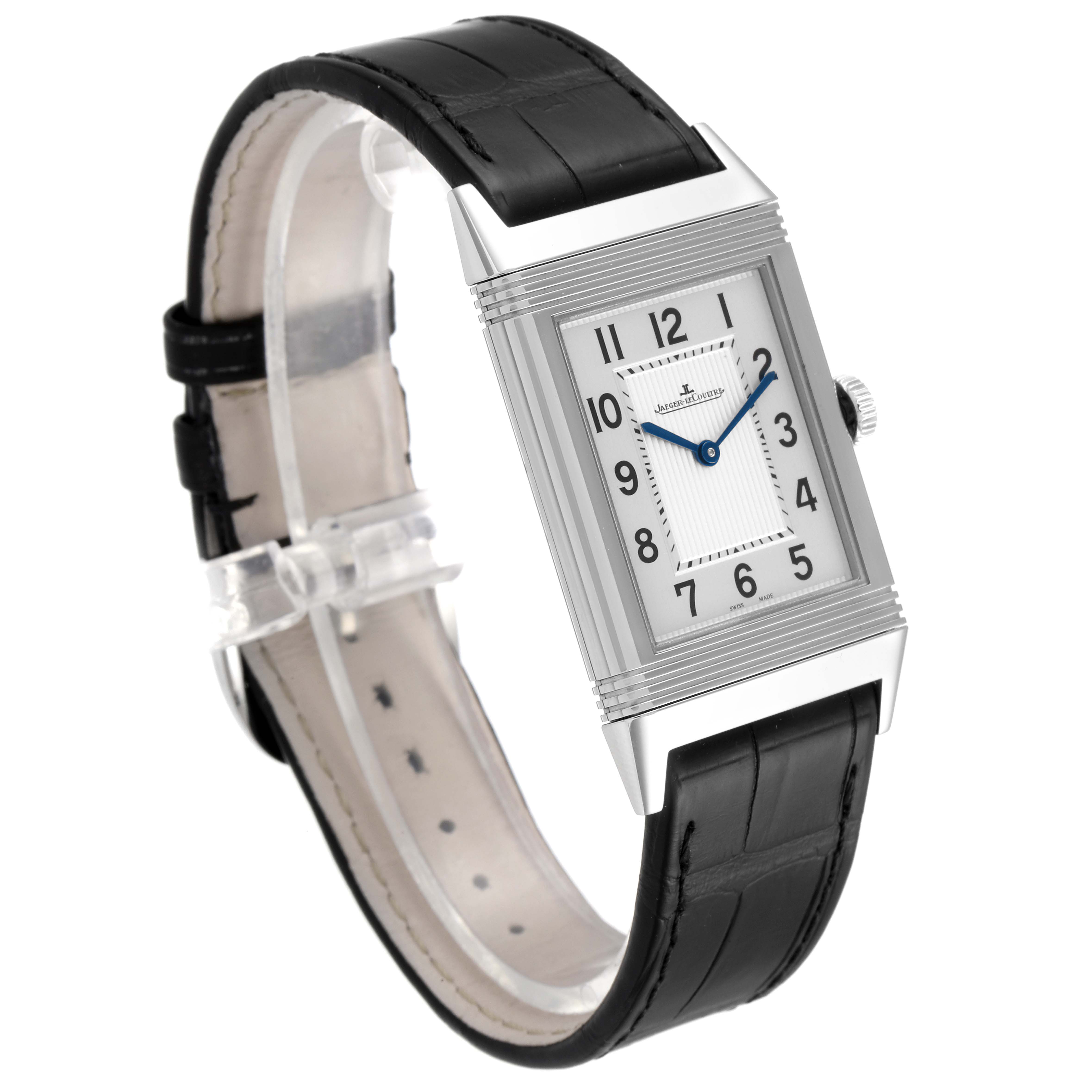 The Jaeger-LeCoultre Reverso watch is shown at an angled front view, displaying its rectangular face and black leather strap.