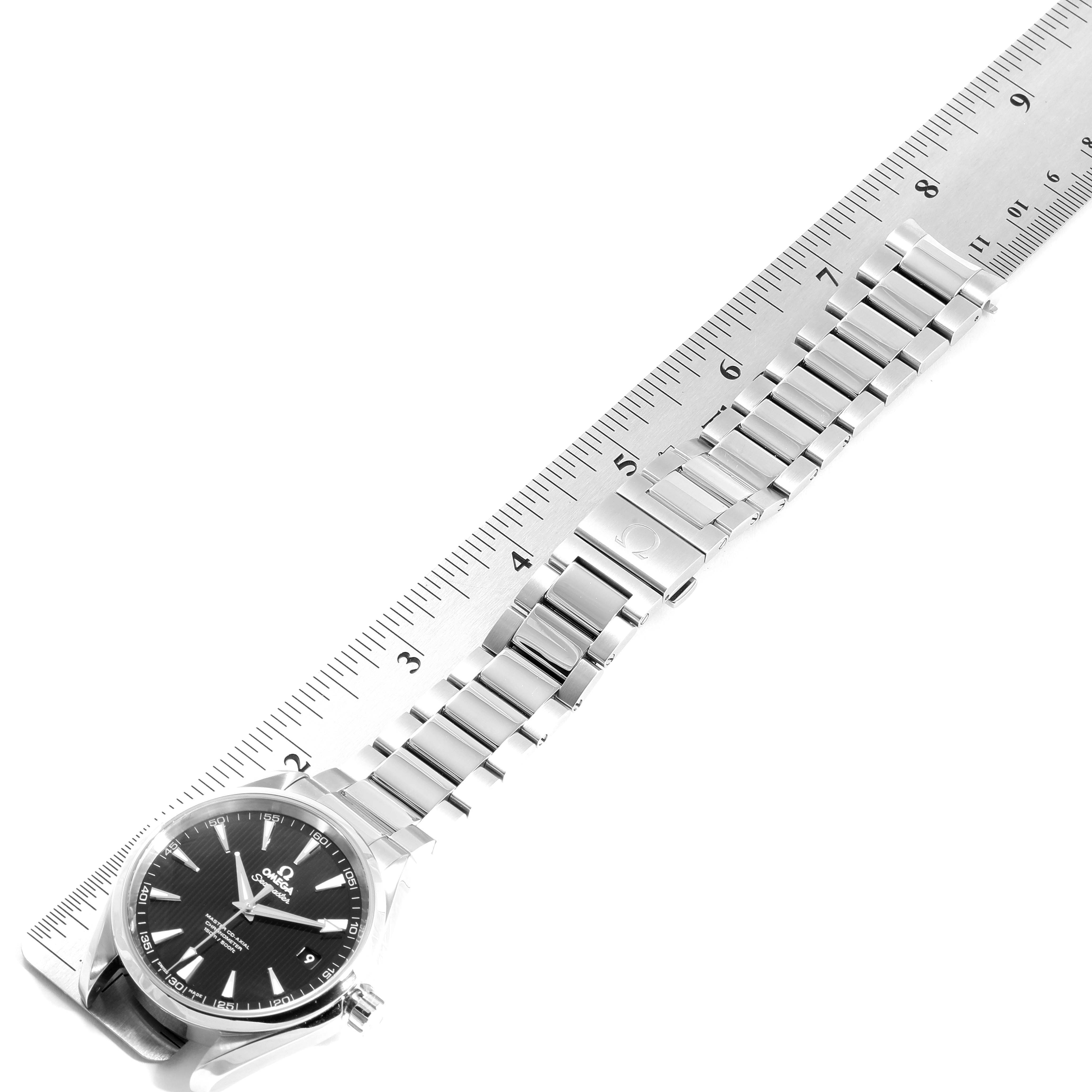 The image shows an Omega Aqua Terra 231.10.42.21.01.003 Men
s Stainless Steel Black Dial 231.10.42.21.01.003 Men
s Stainless Steel Black Dial watch laid flat alongside a ruler, displaying the front face, bracelet, and clasp.