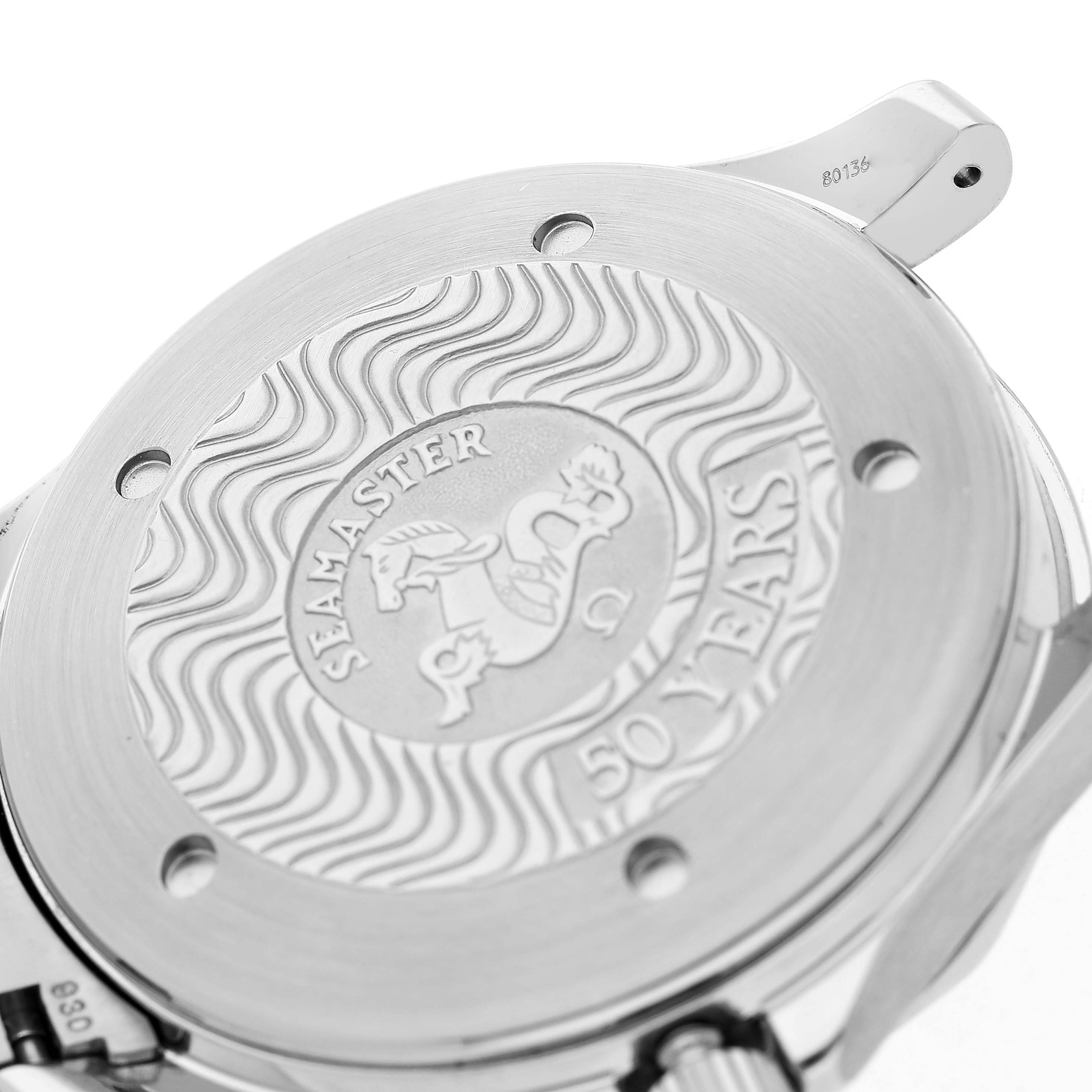 The image shows the case back of an Omega Seamaster 2534.50.00 Men's Stainless Steel Black Dial, featuring an embossed design and the "50 Years" inscription.