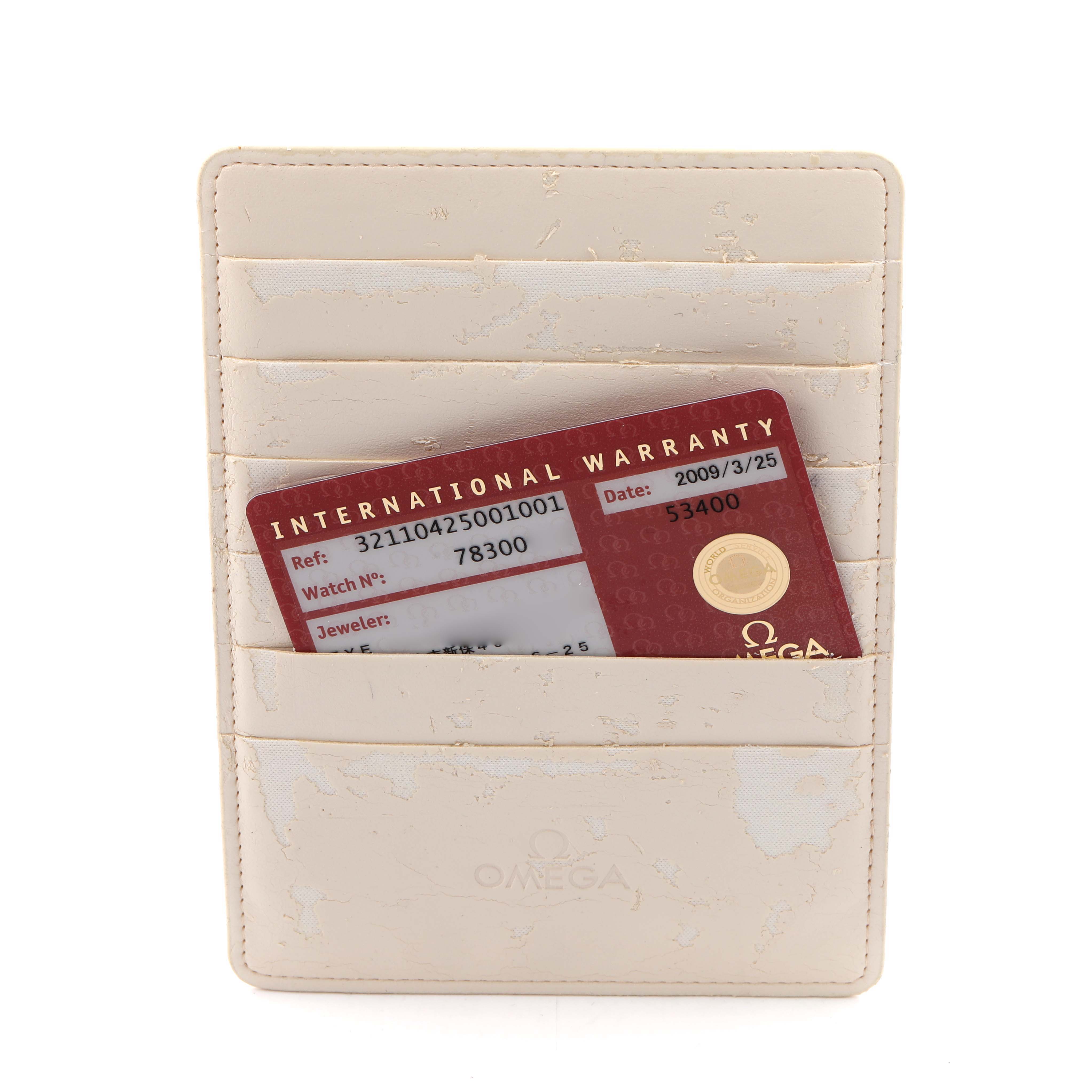 This image shows the Omega Speedmaster 321.10.42.50.01.001 Men
s Stainless Steel Black Dial 321.10.42.50.01.001 Men
s Stainless Steel Black Dial
s international warranty card in a light-colored card holder.