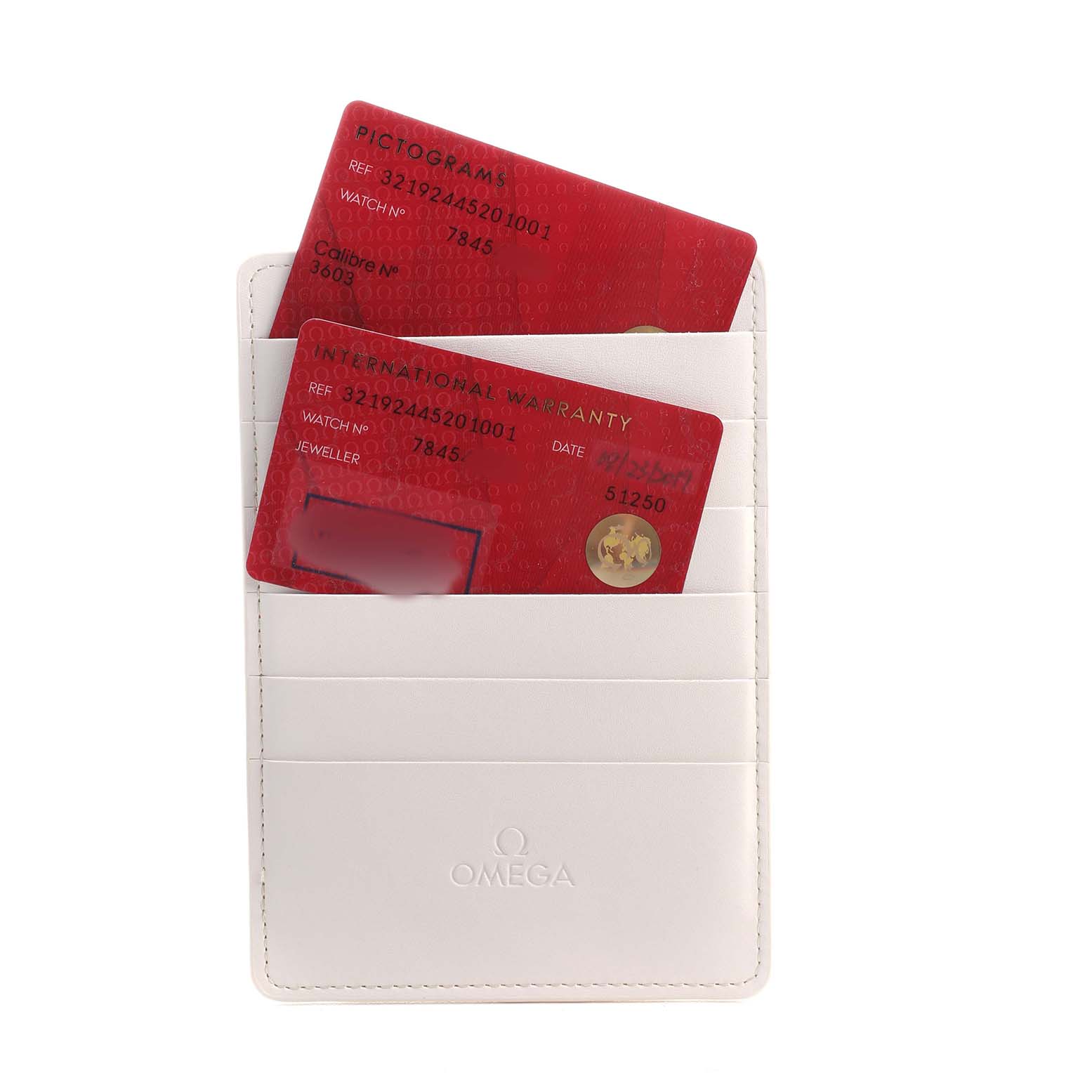 The image shows warranty and pictogram cards for an Omega Speedmaster 321.92.44.52.01.001 Men's Titanium Black Dial, housed in a branded cardholder.