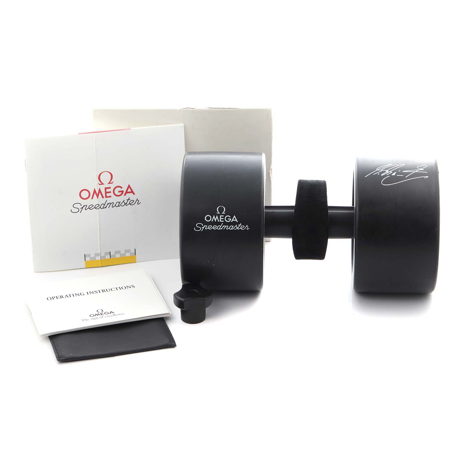 The image shows the Omega Speedmaster 3510.61.00 Men
s Stainless Steel Red Dial 3510.61.00 Men
s Stainless Steel Red Dial accessories, including a presentation box, operating instructions, and casing from a side angle.