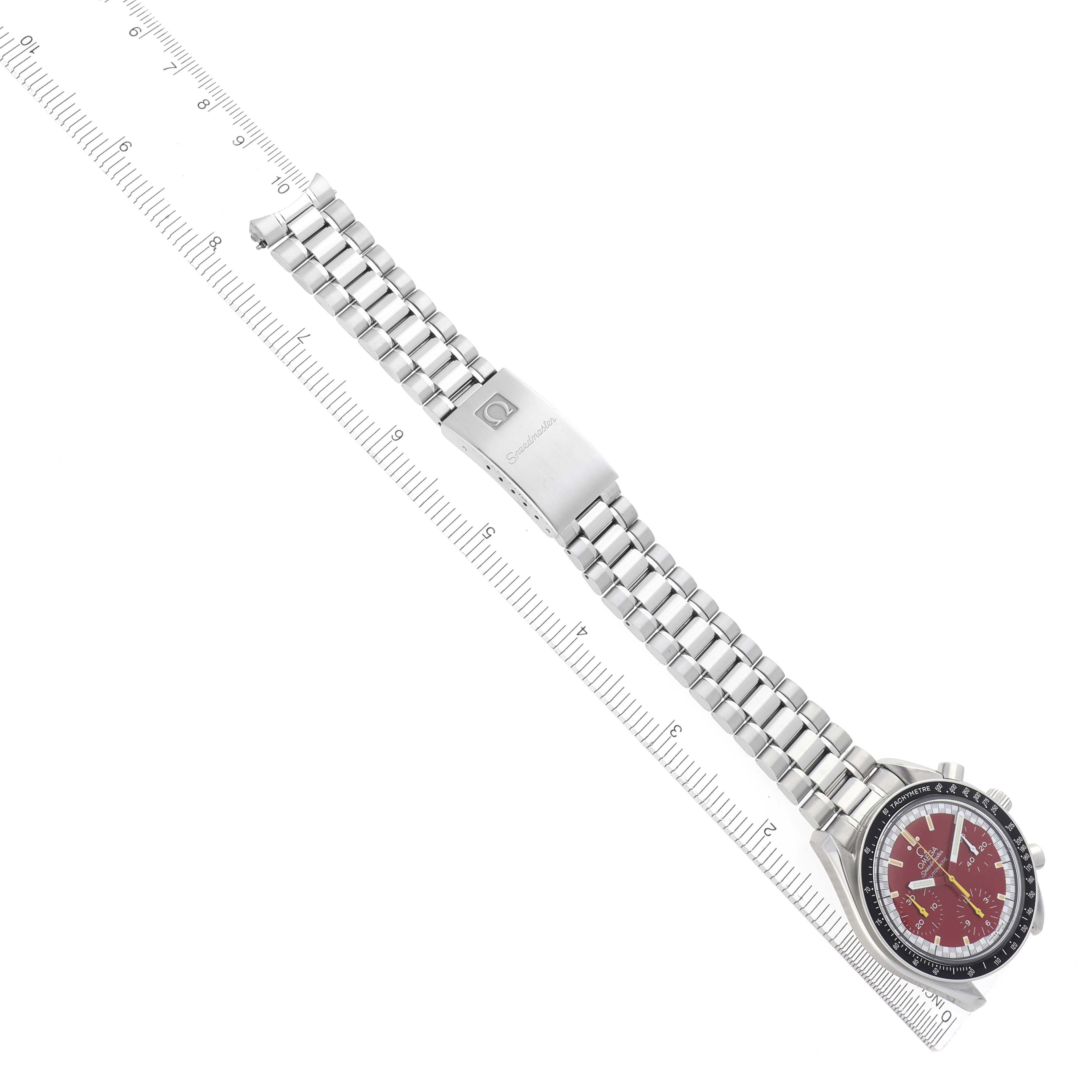 The Omega Speedmaster 3510.61.00 Men
s Stainless Steel Red Dial 3510.61.00 Men
s Stainless Steel Red Dial watch is shown from a top-down angle, highlighting the face, bracelet, and clasp.