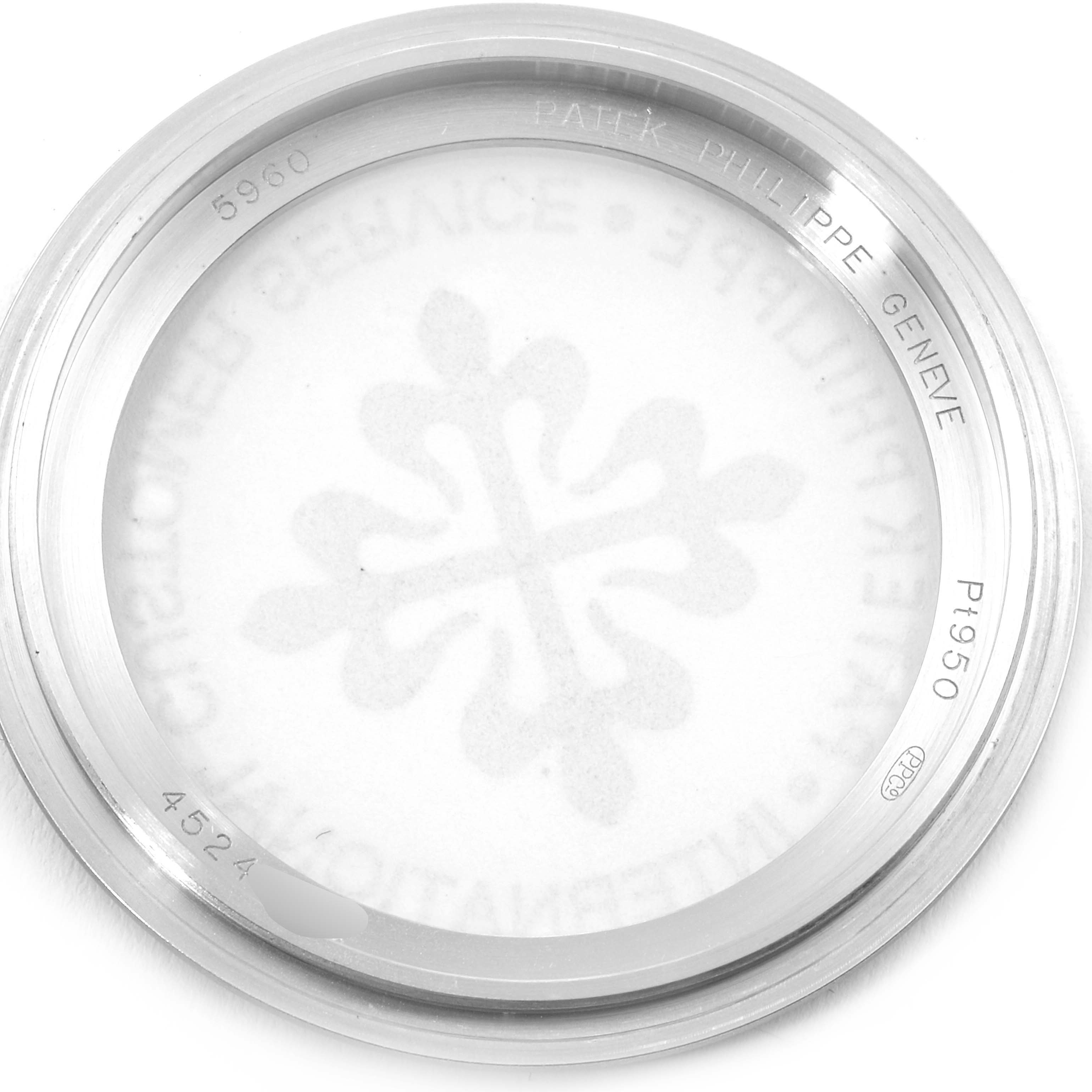 This image shows the back case cover of a Patek Philippe Complications 5960/01G Men's White Gold Blue Dial 5960/01G Men's White Gold Blue Dial model watch, featuring the brand name and model number 5960.