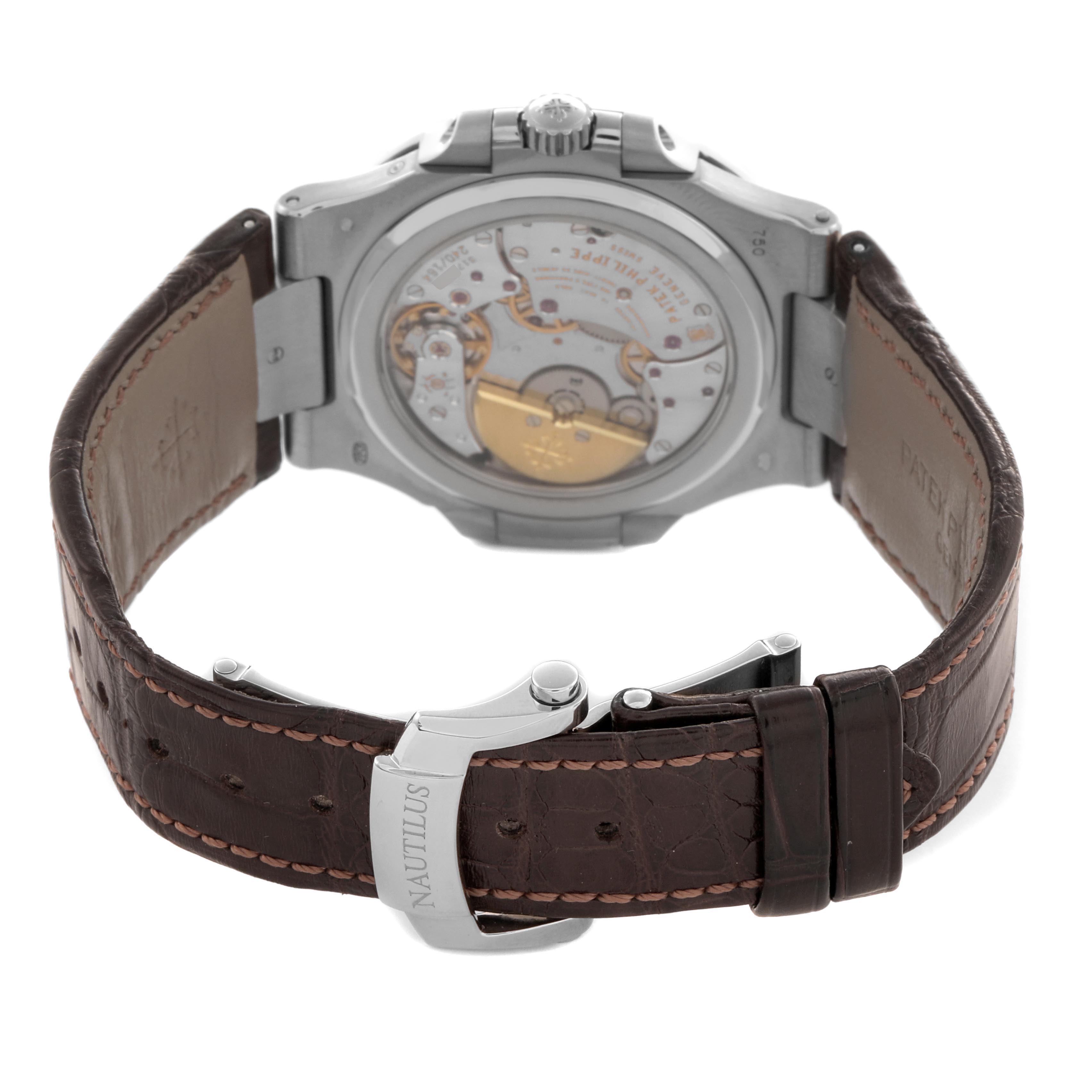 The image shows the back view of a Patek Philippe Nautilus 5712G-001 Men's White Gold Grey Dial 5712G-001 Men's White Gold Grey Dial, highlighting the movement and clasp on a leather strap.