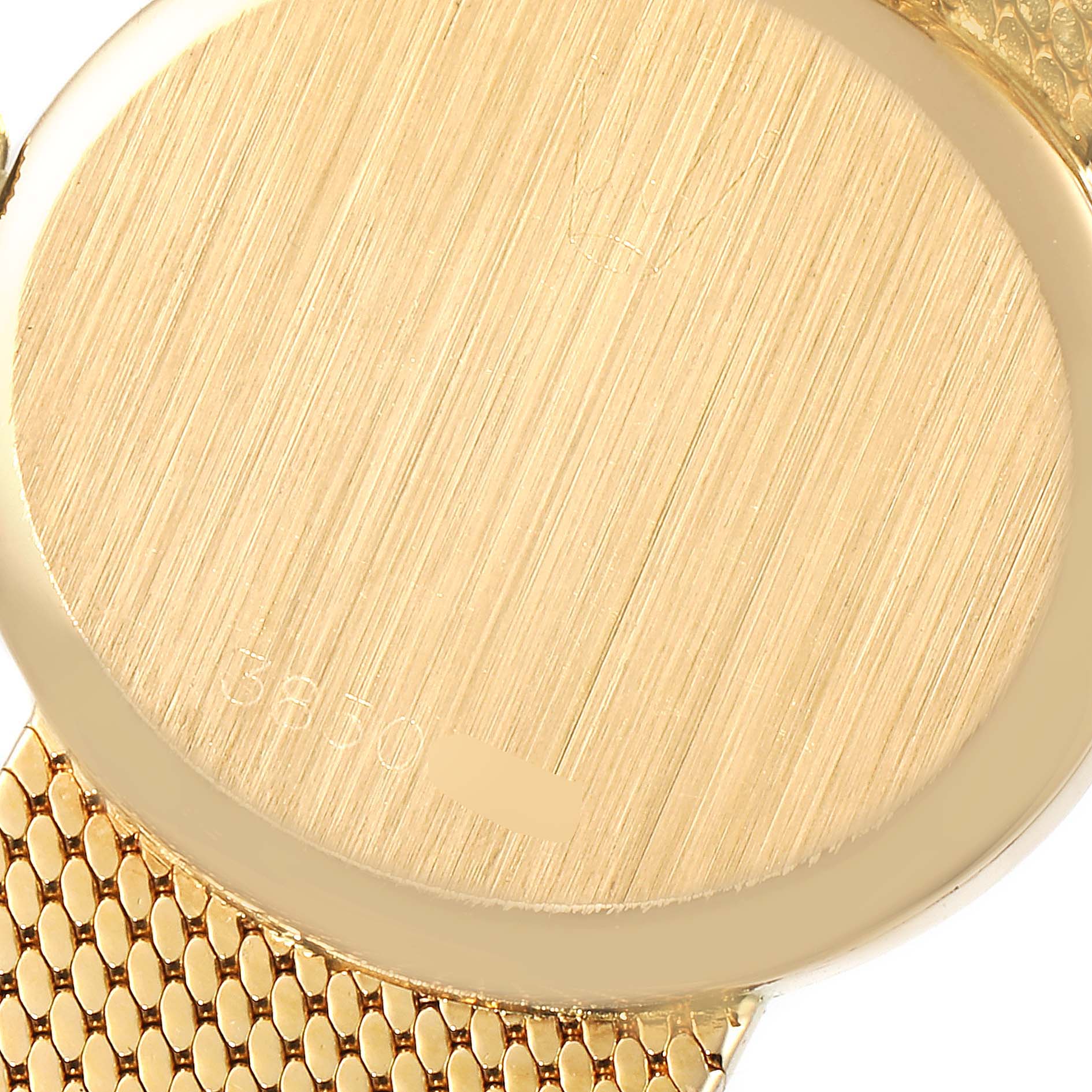 This image shows the back case and part of the bracelet of a Rolex Cellini  Women
s Yellow Gold Champagne Dial  Women
s Yellow Gold Champagne Dial watch.