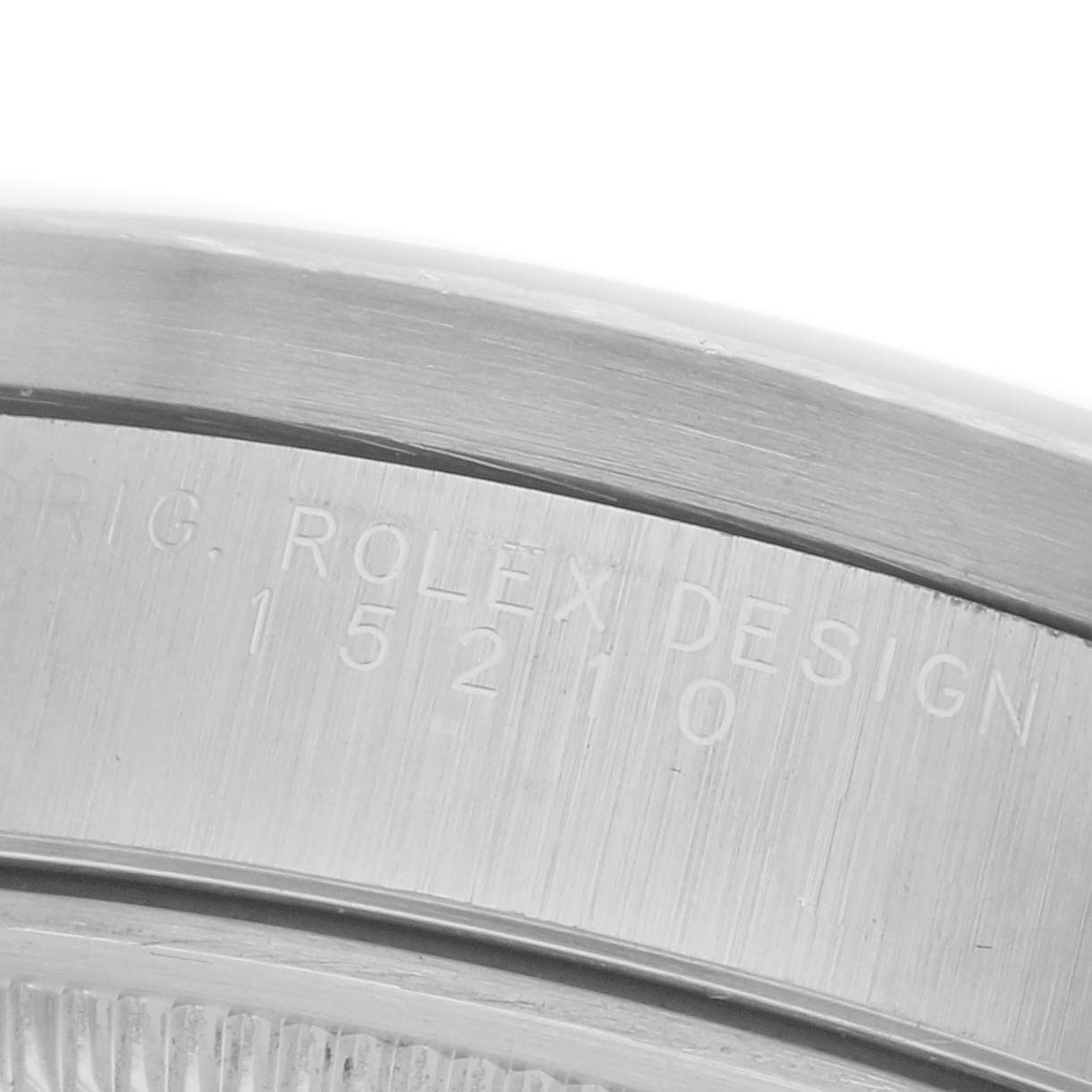 The image shows a close-up of the serial engraving on the case side of a Rolex Date 15210 Men
s Stainless Steel Silver Dial 15210 Men
s Stainless Steel Silver Dial model watch.