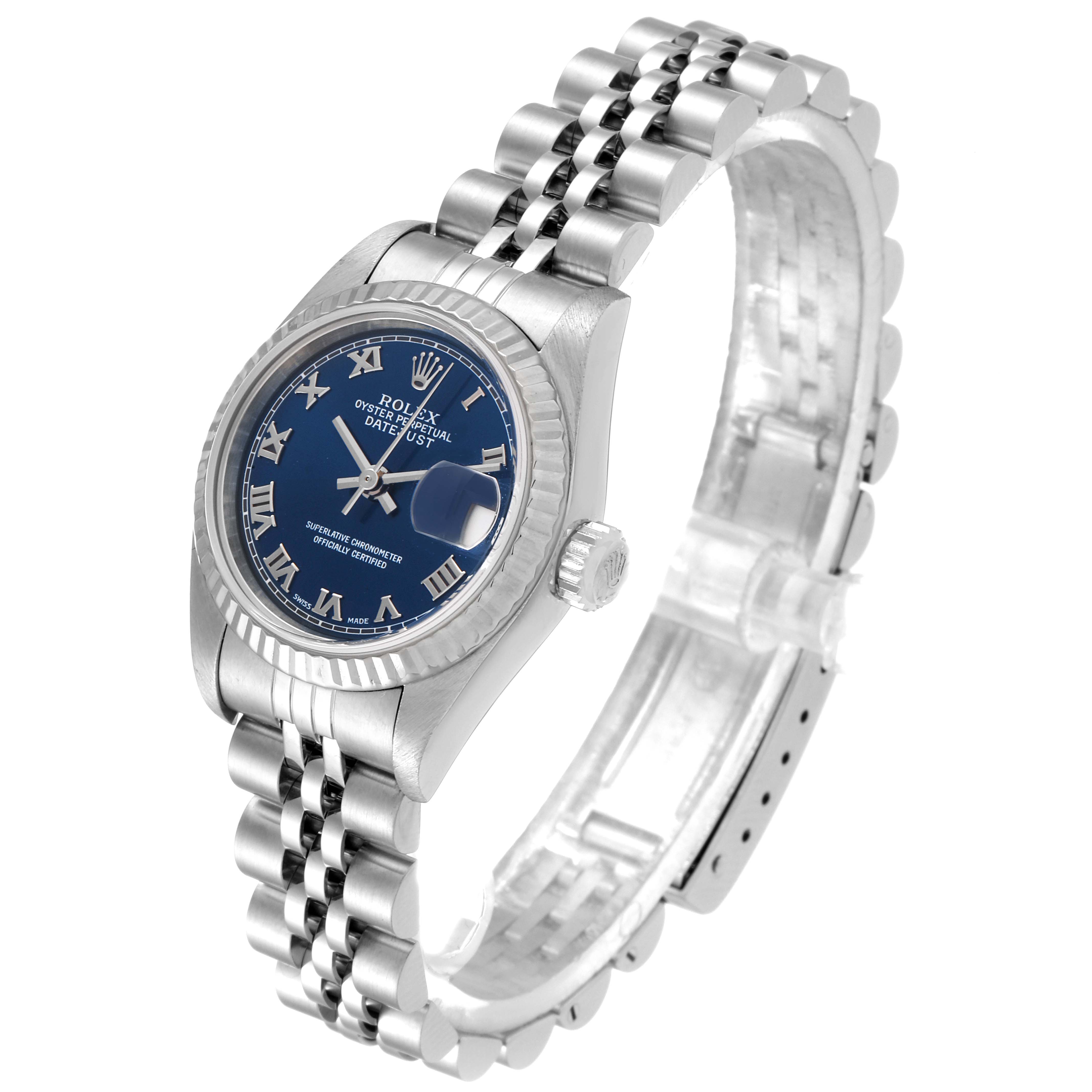 The image shows an angled view of a Rolex Datejust 79174 Women's Stainless Steel Blue Dial 79174 Women's Stainless Steel Blue Dial watch, highlighting the face, crown, and fluted bezel, with its Jubilee bracelet.