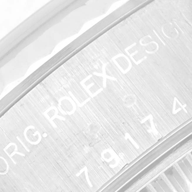 This image shows a close-up of the inner bezel engraving on a Rolex Datejust 79174 Women's Stainless Steel Silver Dial 79174 Women's Stainless Steel Silver Dial watch.