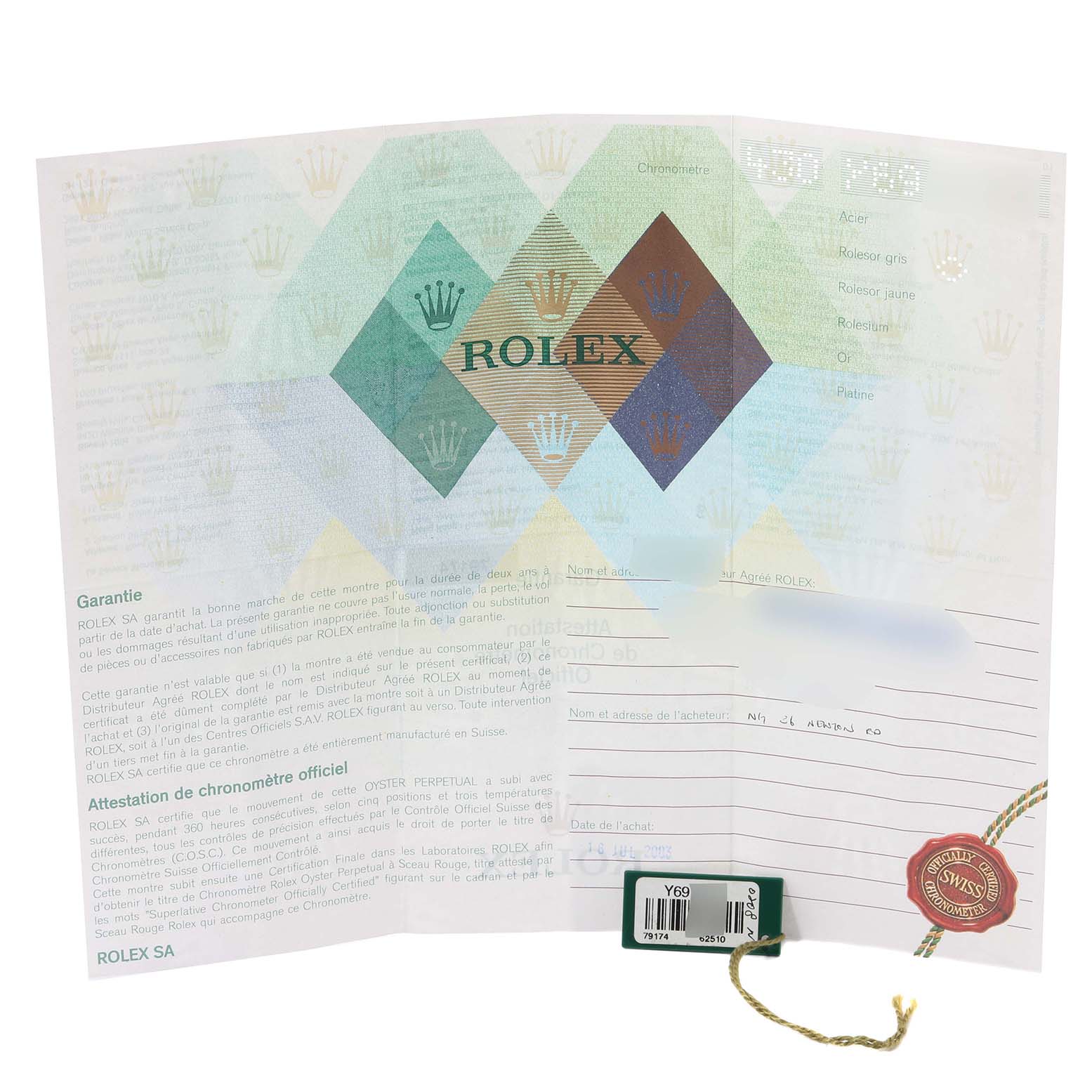This image shows the warranty and certification papers for a Rolex Datejust 79174 Women's Stainless Steel Silver Dial 79174 Women's Stainless Steel Silver Dial watch, with a tag attached.