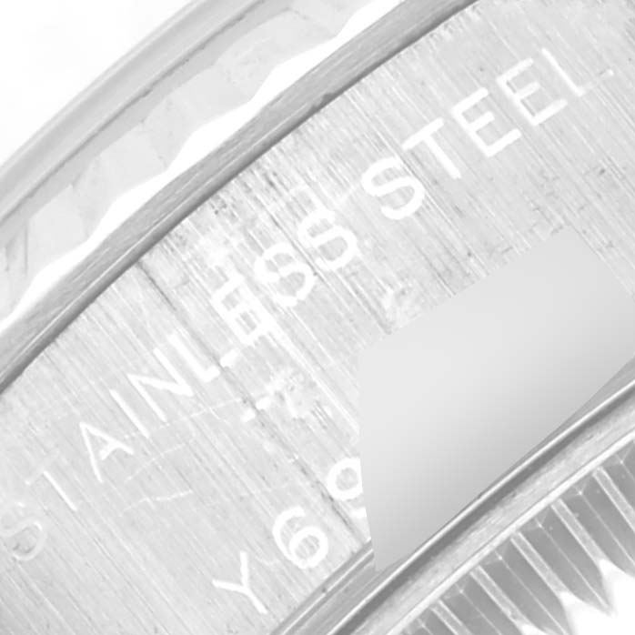 This close-up shows the engraved text on the back casing of a Rolex Datejust 79174 Women's Stainless Steel Silver Dial 79174 Women's Stainless Steel Silver Dial watch.